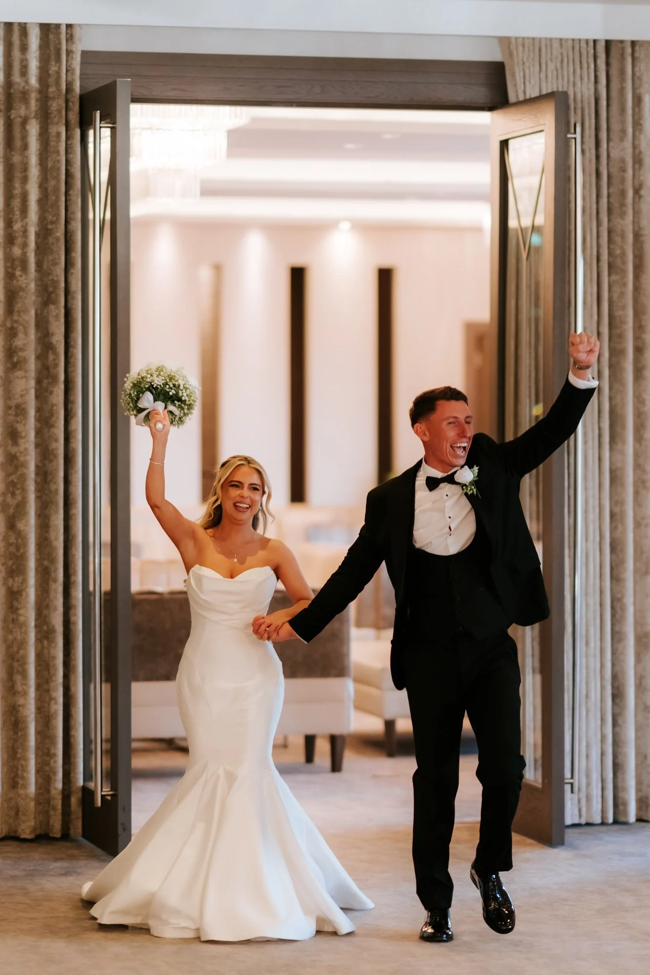 Aiden and Taylor making their entrance into the wedding reception.