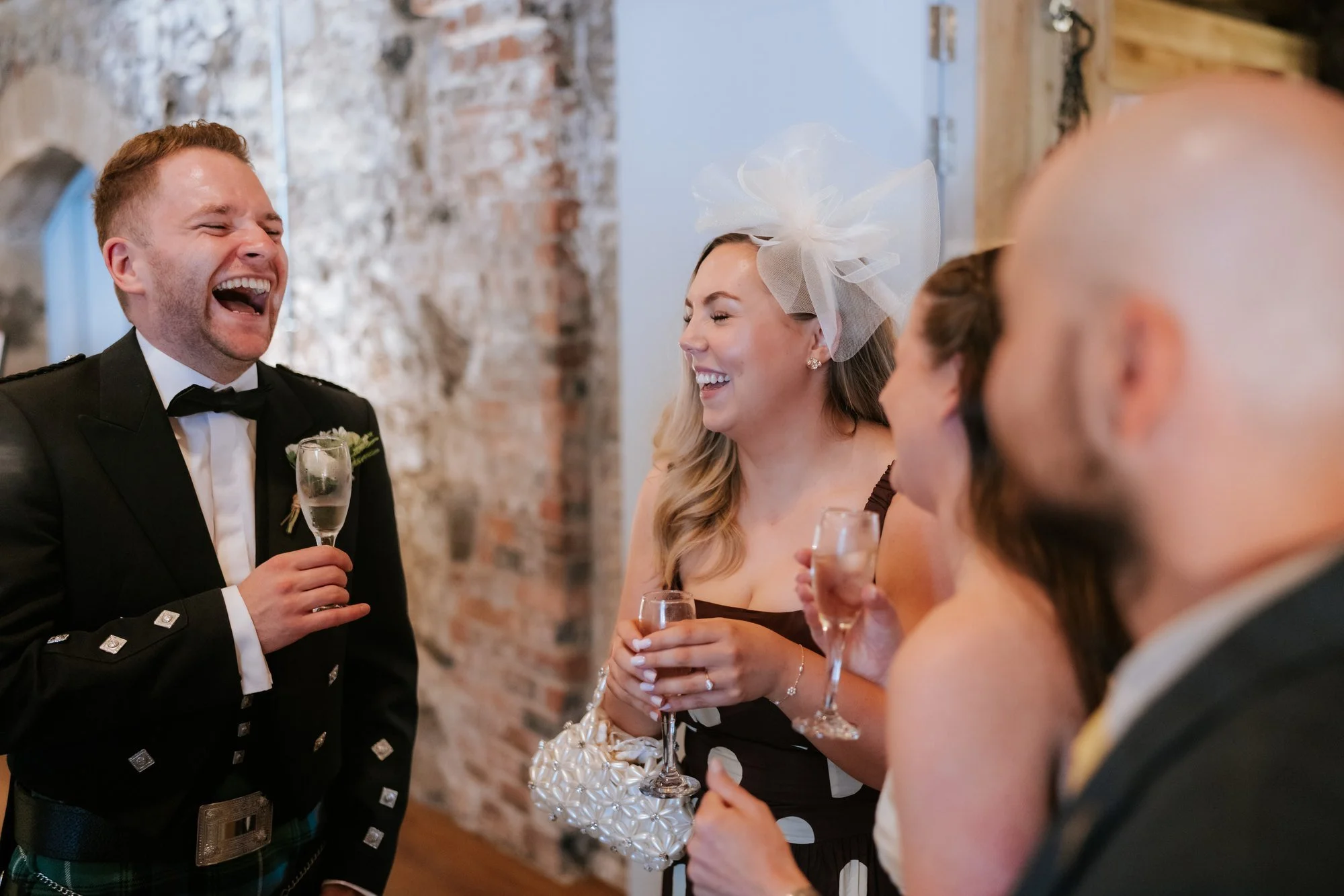 Luke sharing a laugh with guests during the drinks reception.