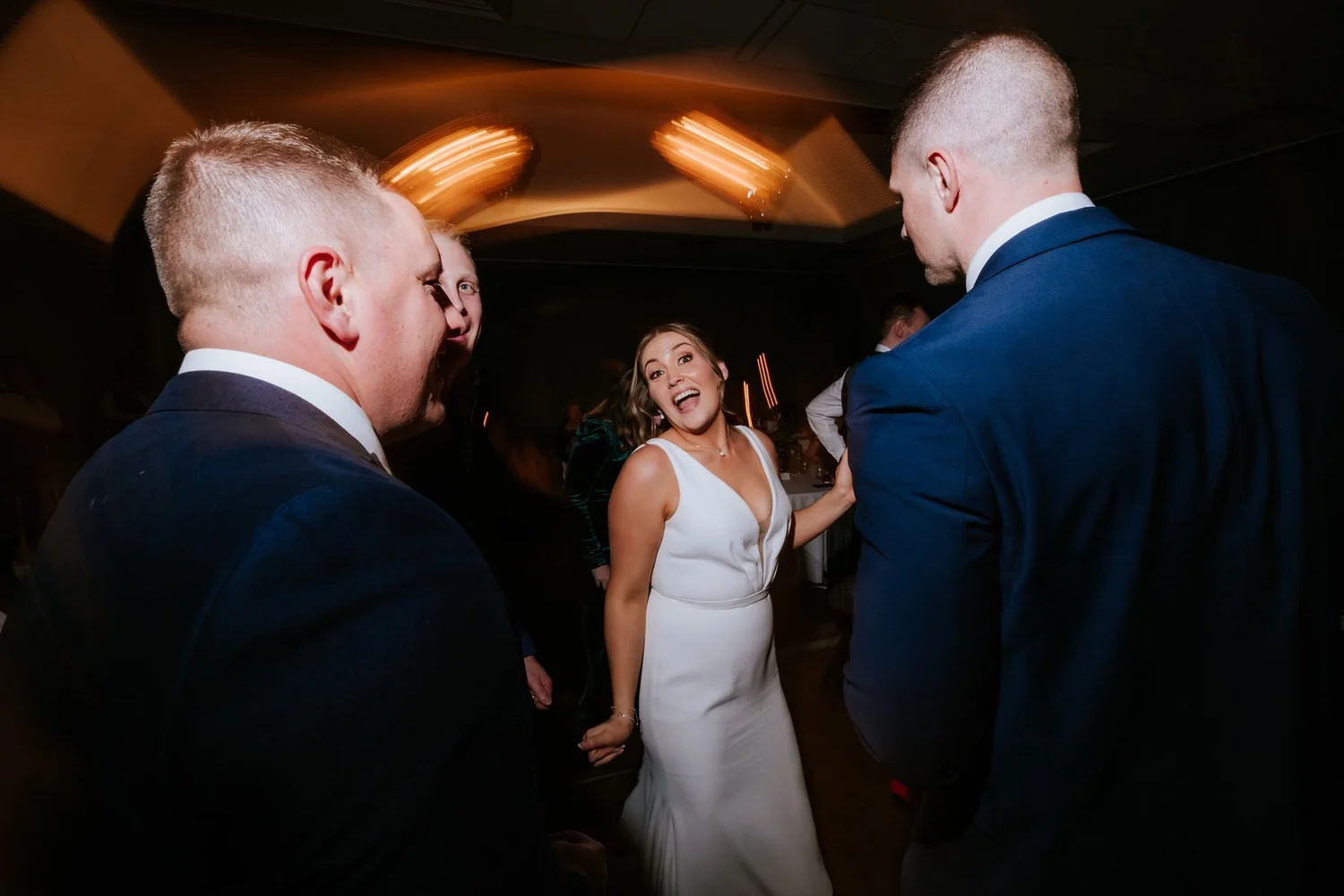 Kendall laughing with guests on the dance floor at SCHLOSS Roxburghe.