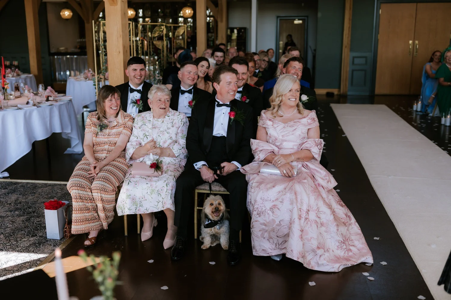 Family and their dog watching from the front row.