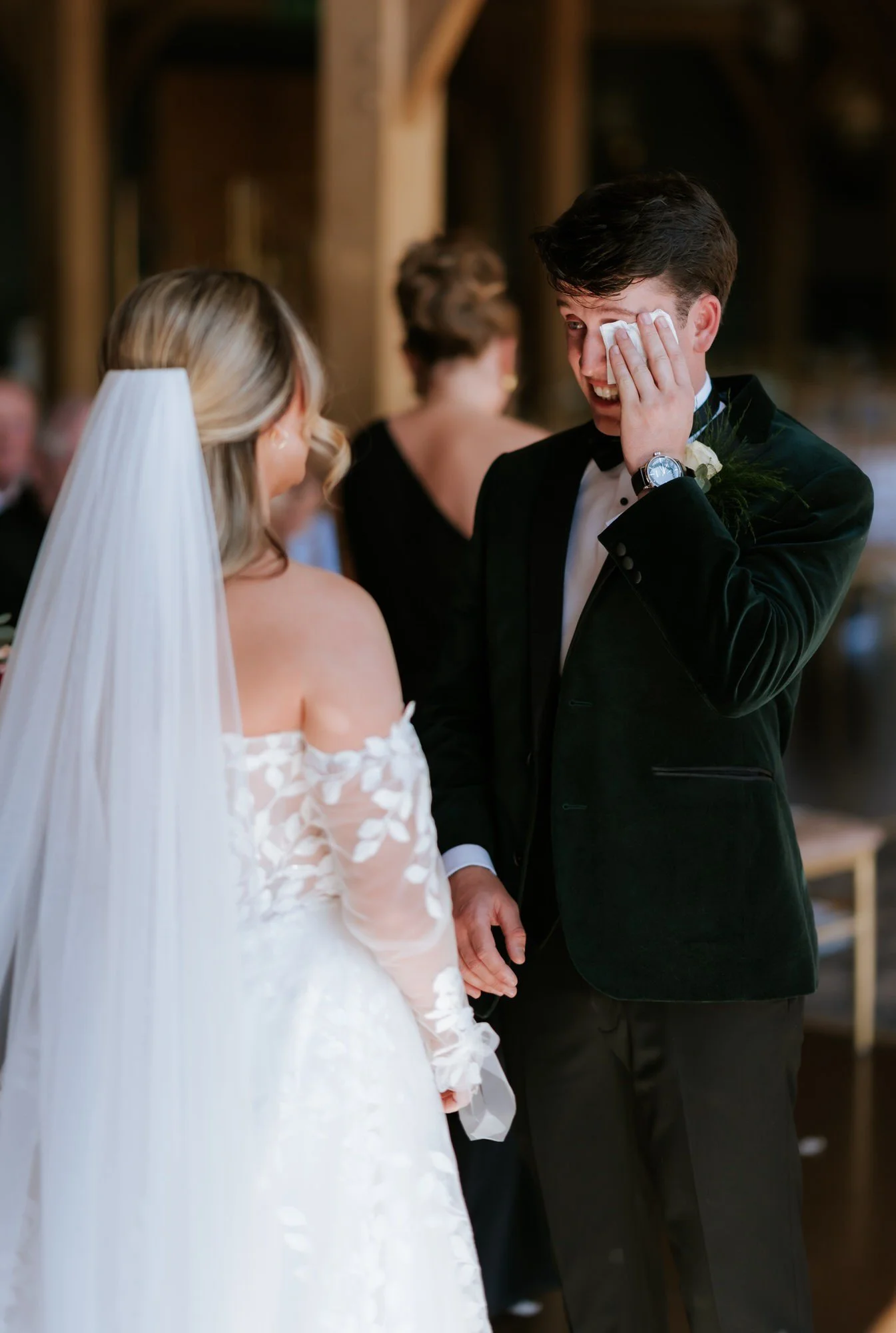Jonathon wiping away a tear during the wedding ceremony.