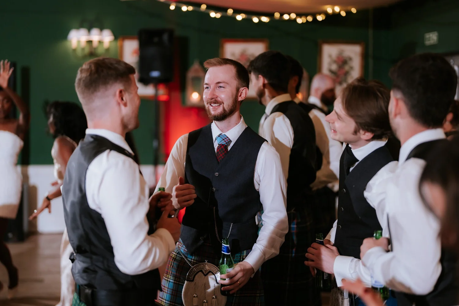Jamie laughing with friends on the dance floor.