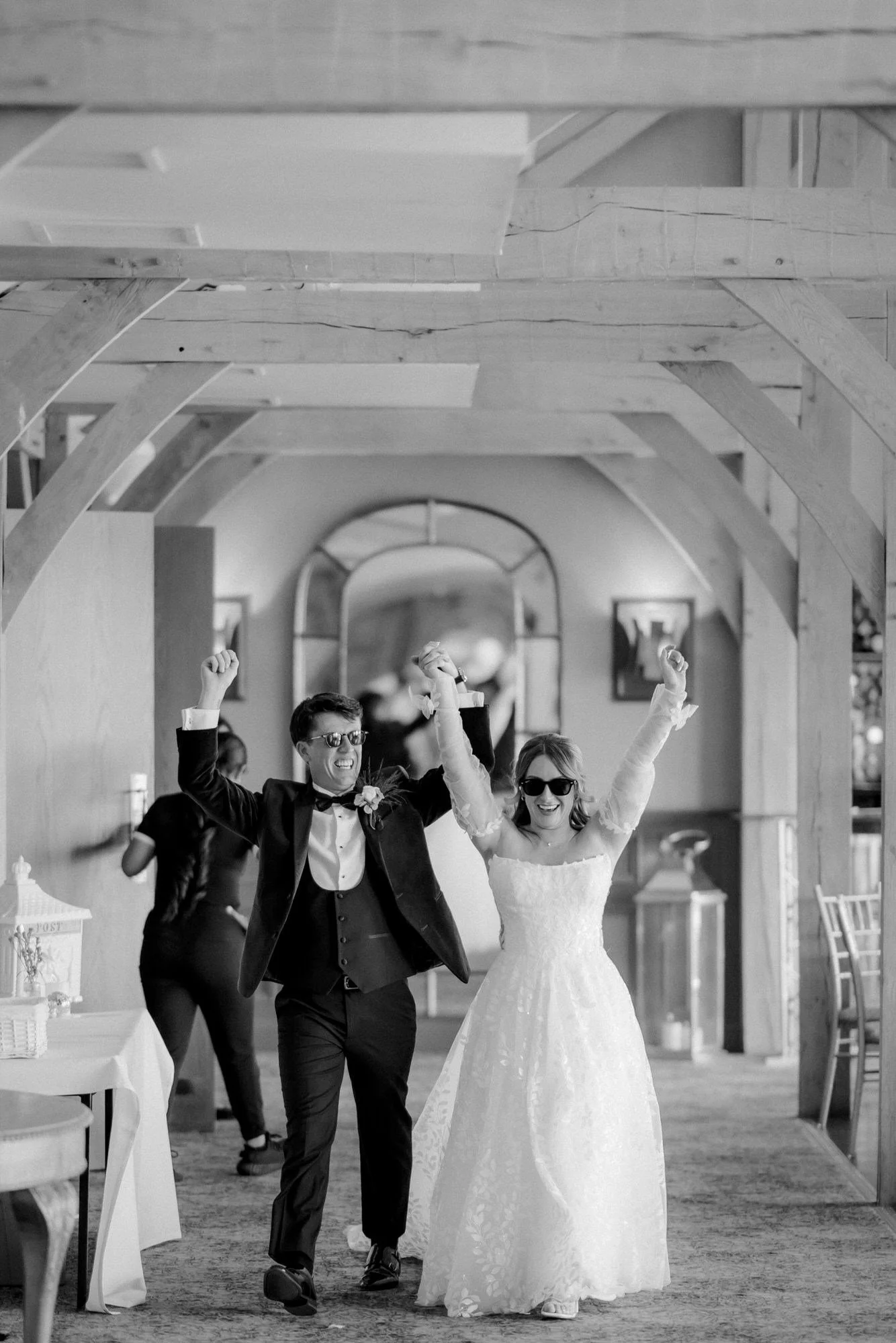 Ciara and Jonathon making an enthusiastic entrance to their wedding breakfast.