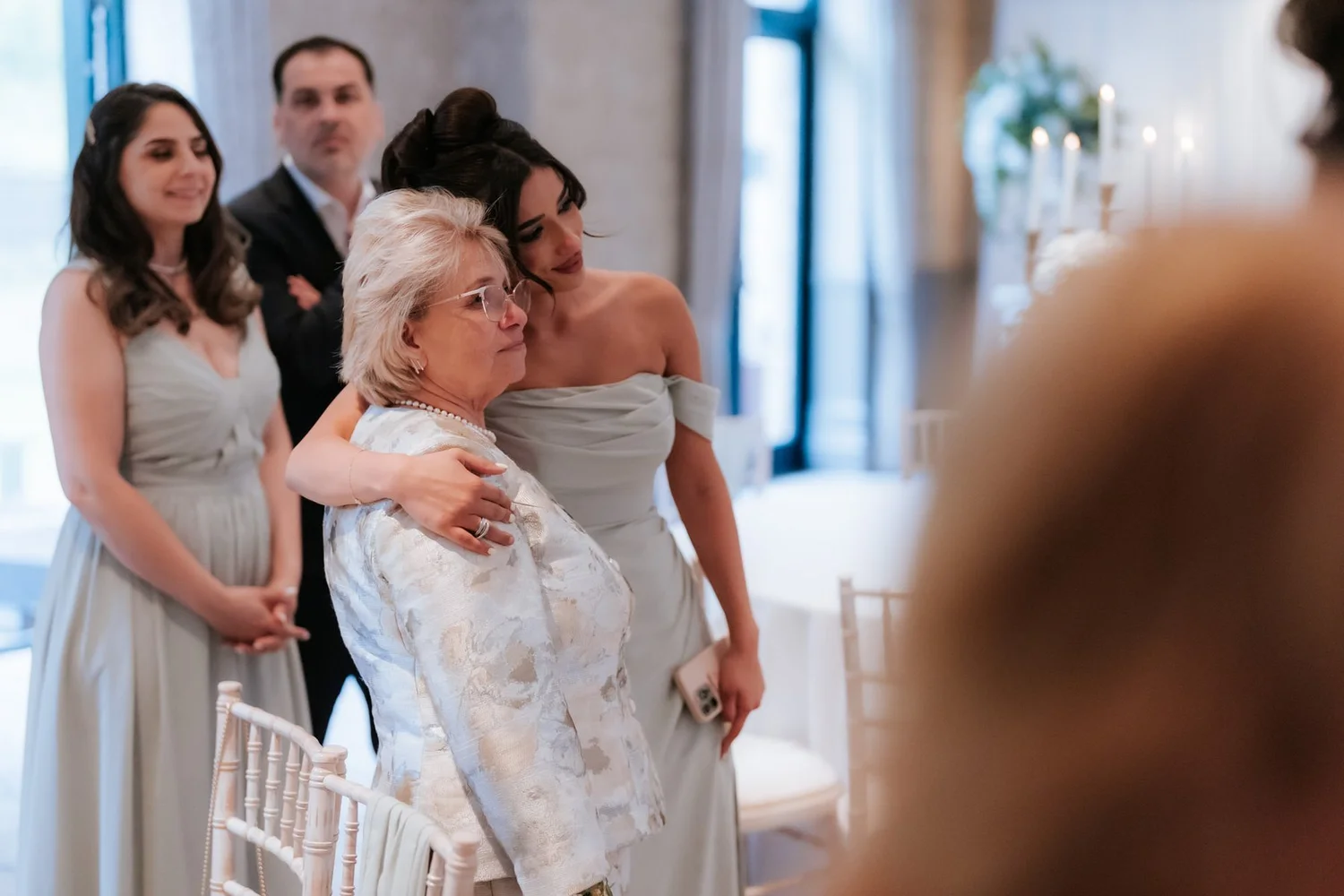 Wedding guests embracing as they watch the dancing at Cameron House.