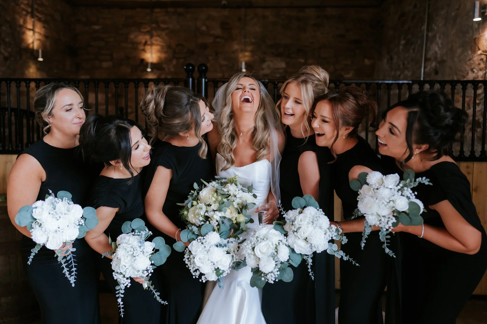 Natalie laughing with her bridesmaids