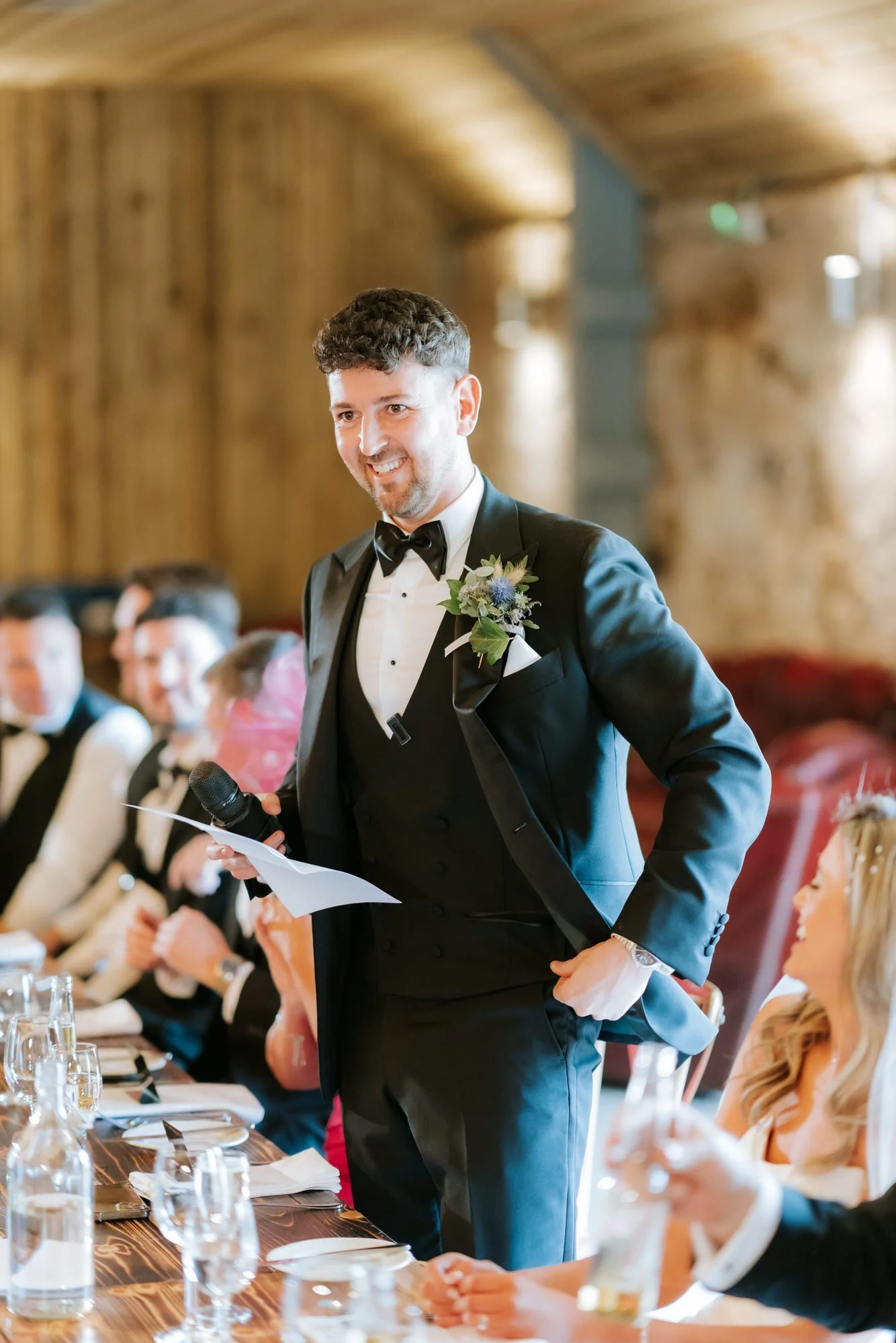 Jamie speaking into a microphone during his wedding speech