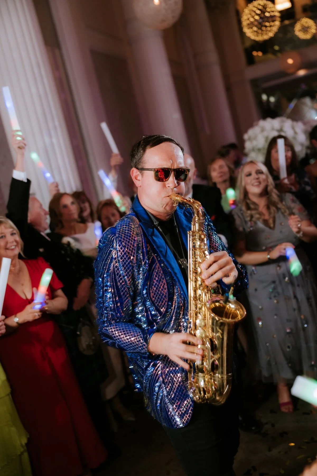 Shades of Sax performing among the wedding guests on the dance floor.