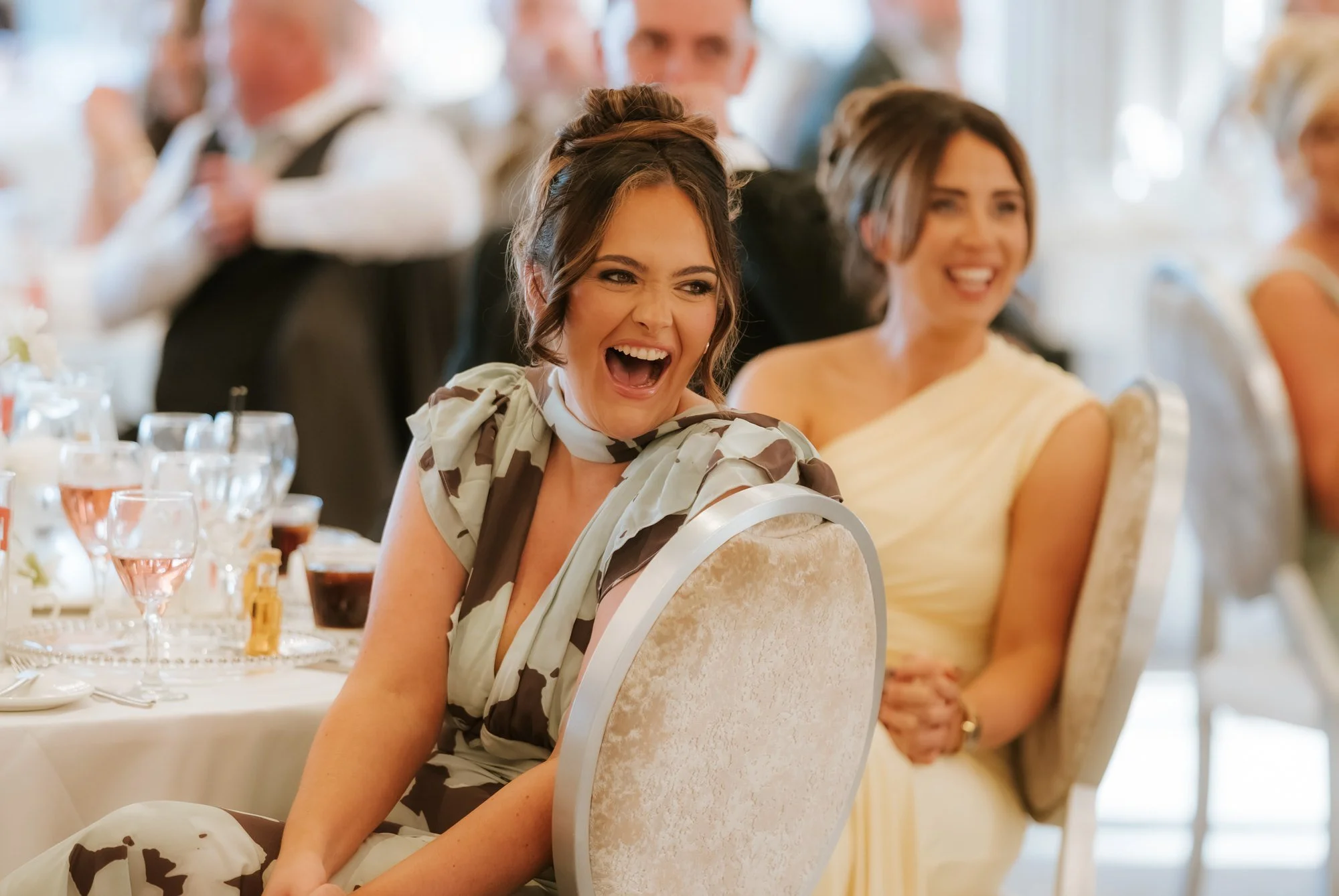 Guests reacting to the wedding speeches.