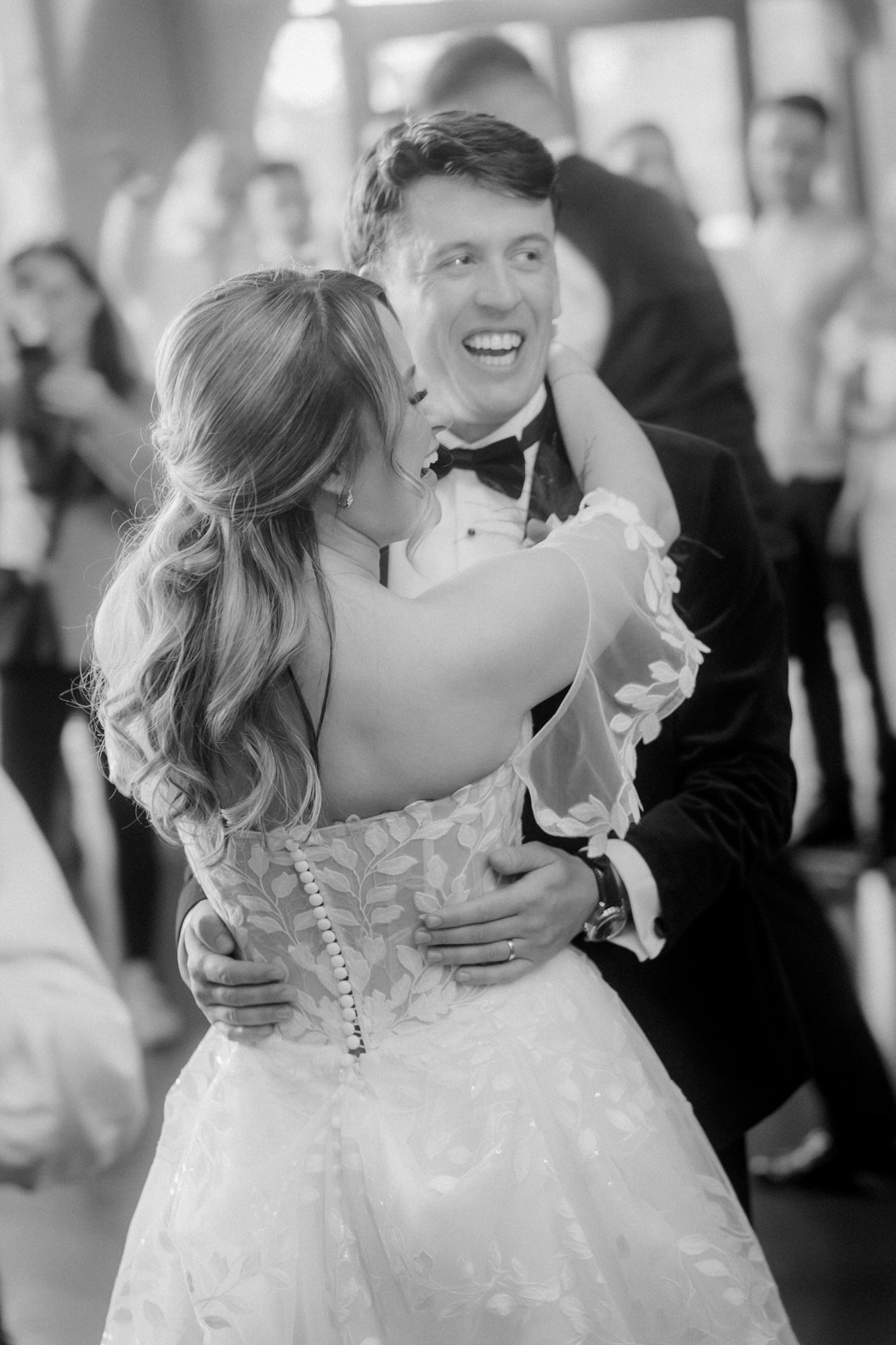 Ciara and Jonathon smiling together during their first dance.