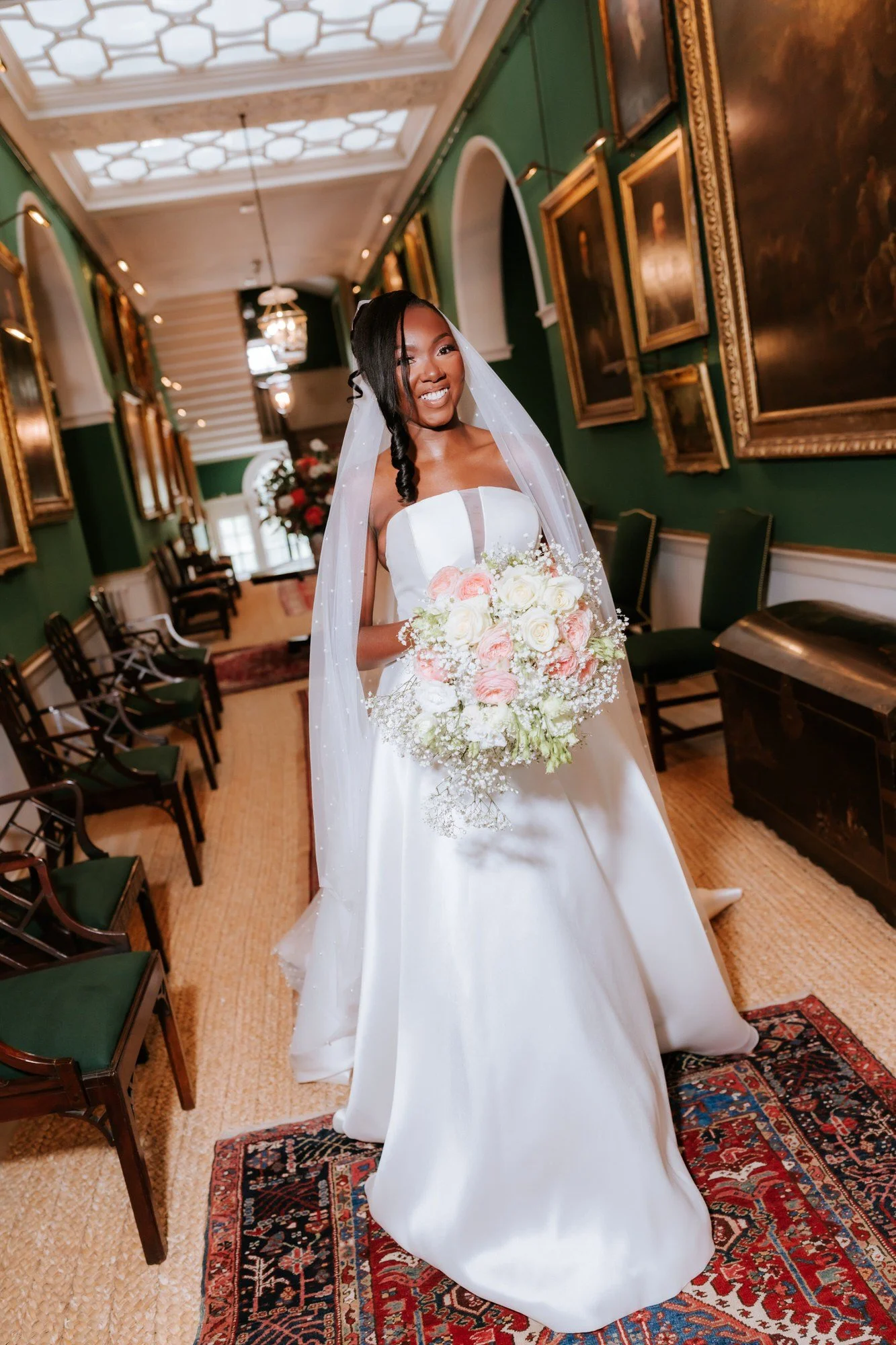 A full-length bridal portrait in the historic interiors of Dumfries House.
