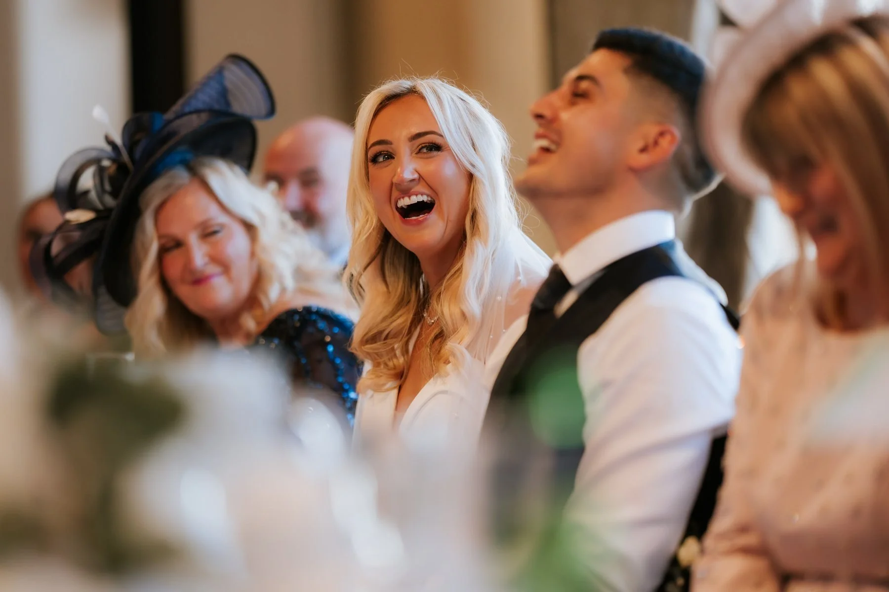 Lauren laughing with her family while listening to the speeches.