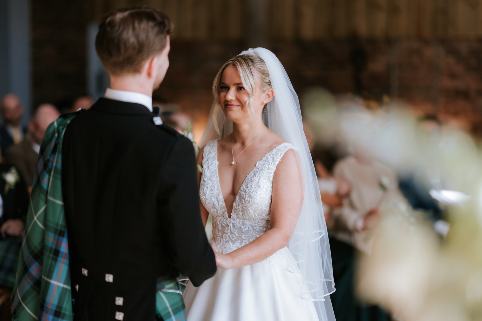 Lilian holding back happy tears during the wedding ceremony.