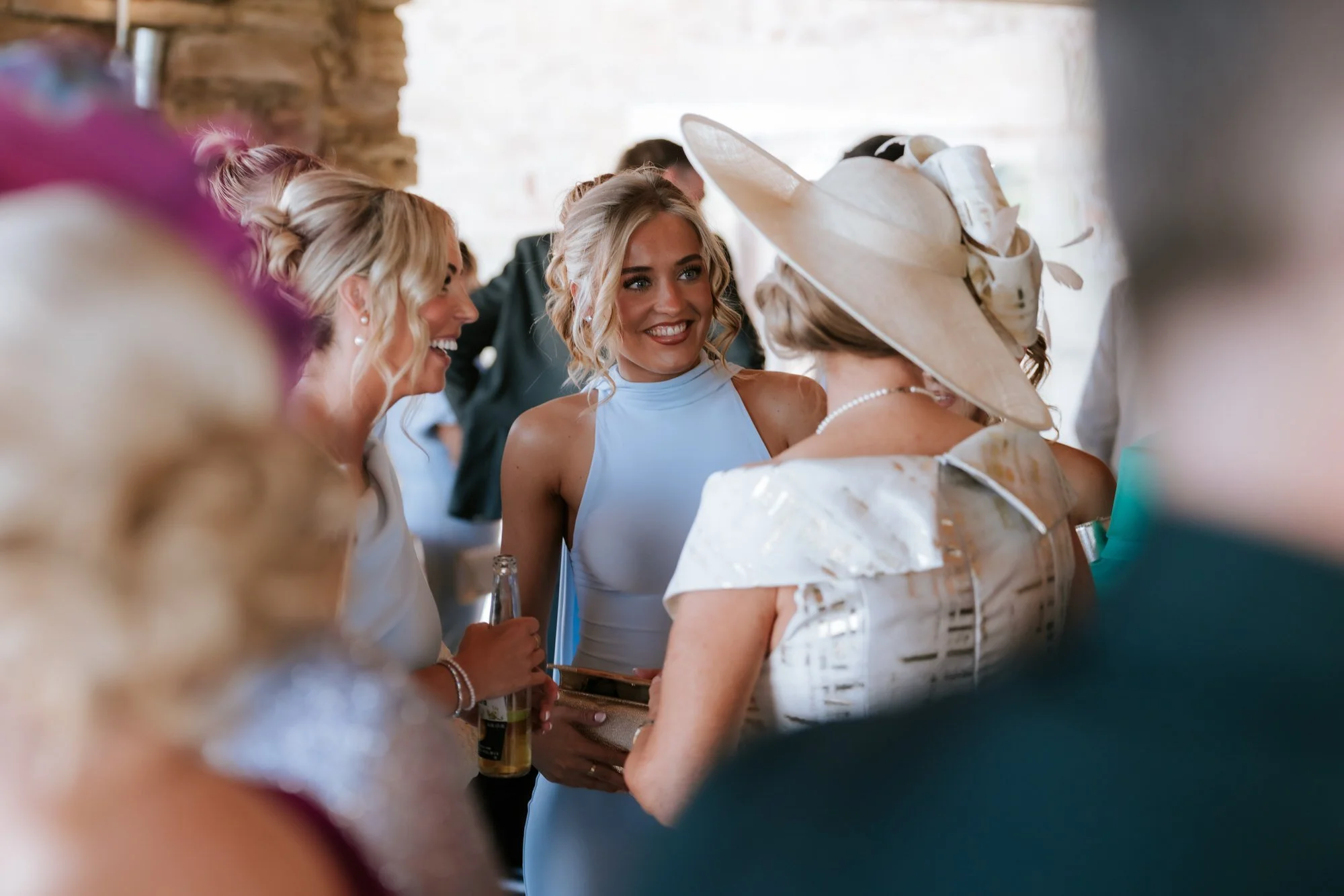 Wedding guests in blue chatting together