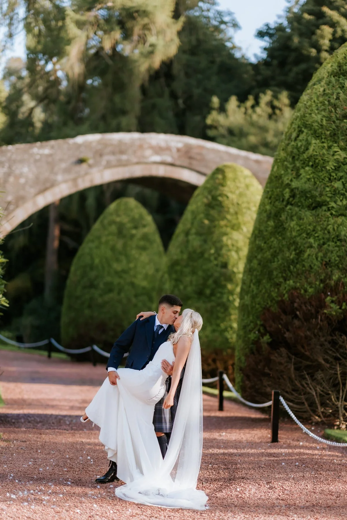 Zen dipping Lauren for a kiss on the garden path beneath Brig o’ Doon bridge.