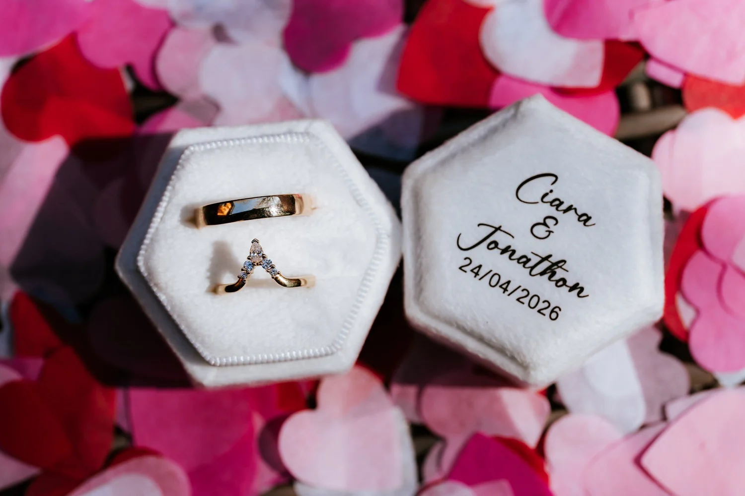 Ciara and Jonathon’s wedding rings in their personalised ring box.