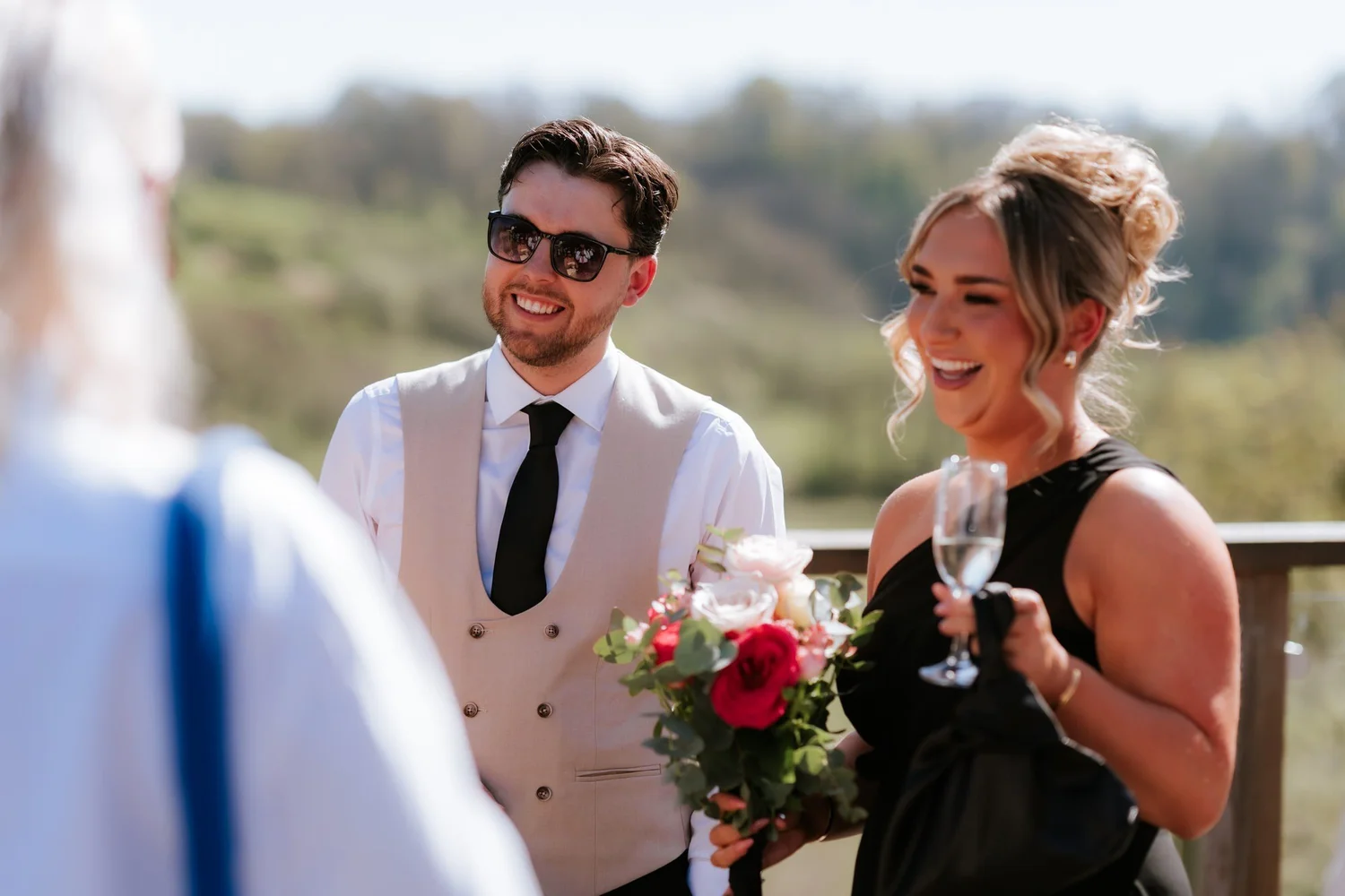 Friends sharing a laugh during the drinks reception.