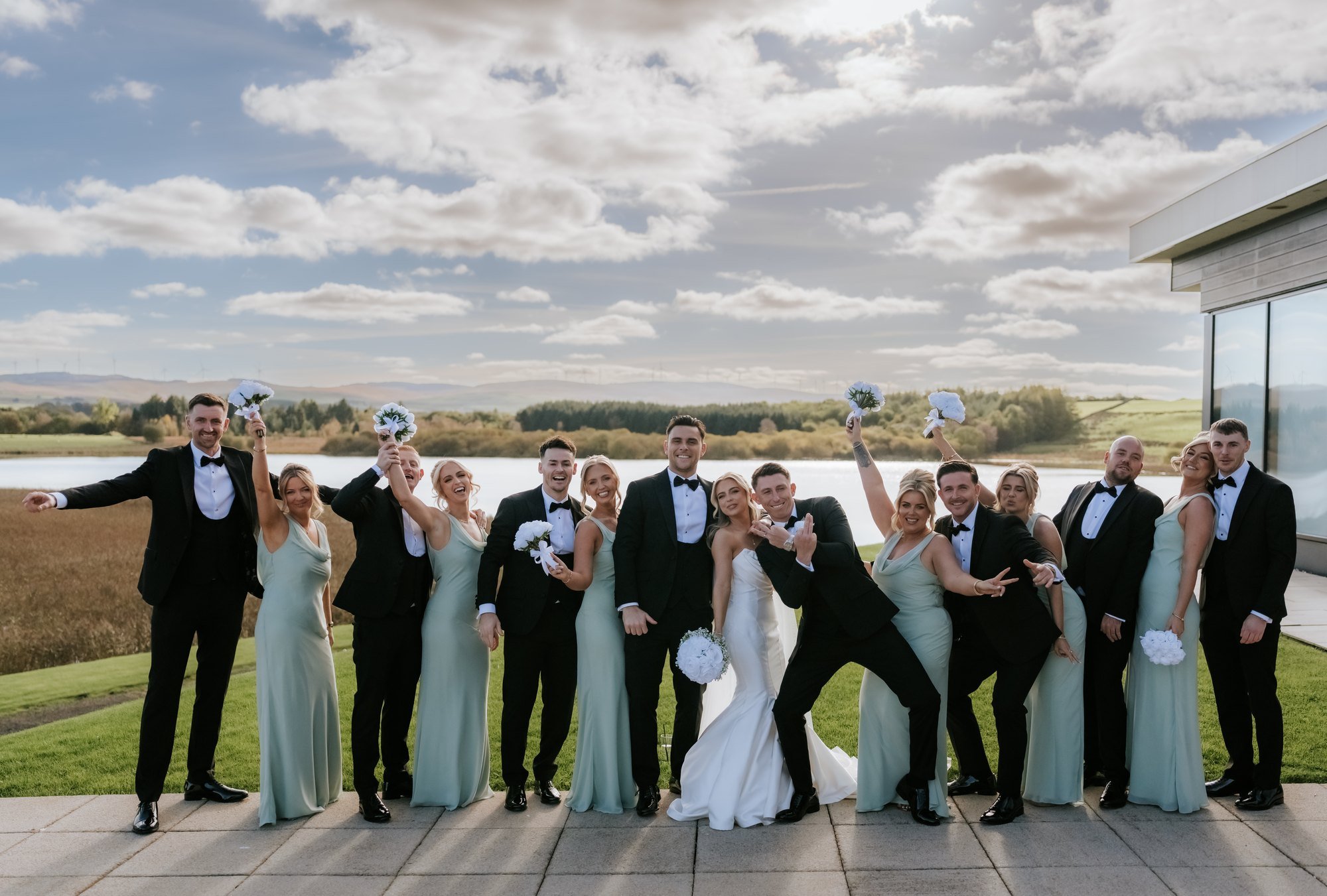 The wedding party celebrating together on the terrace.