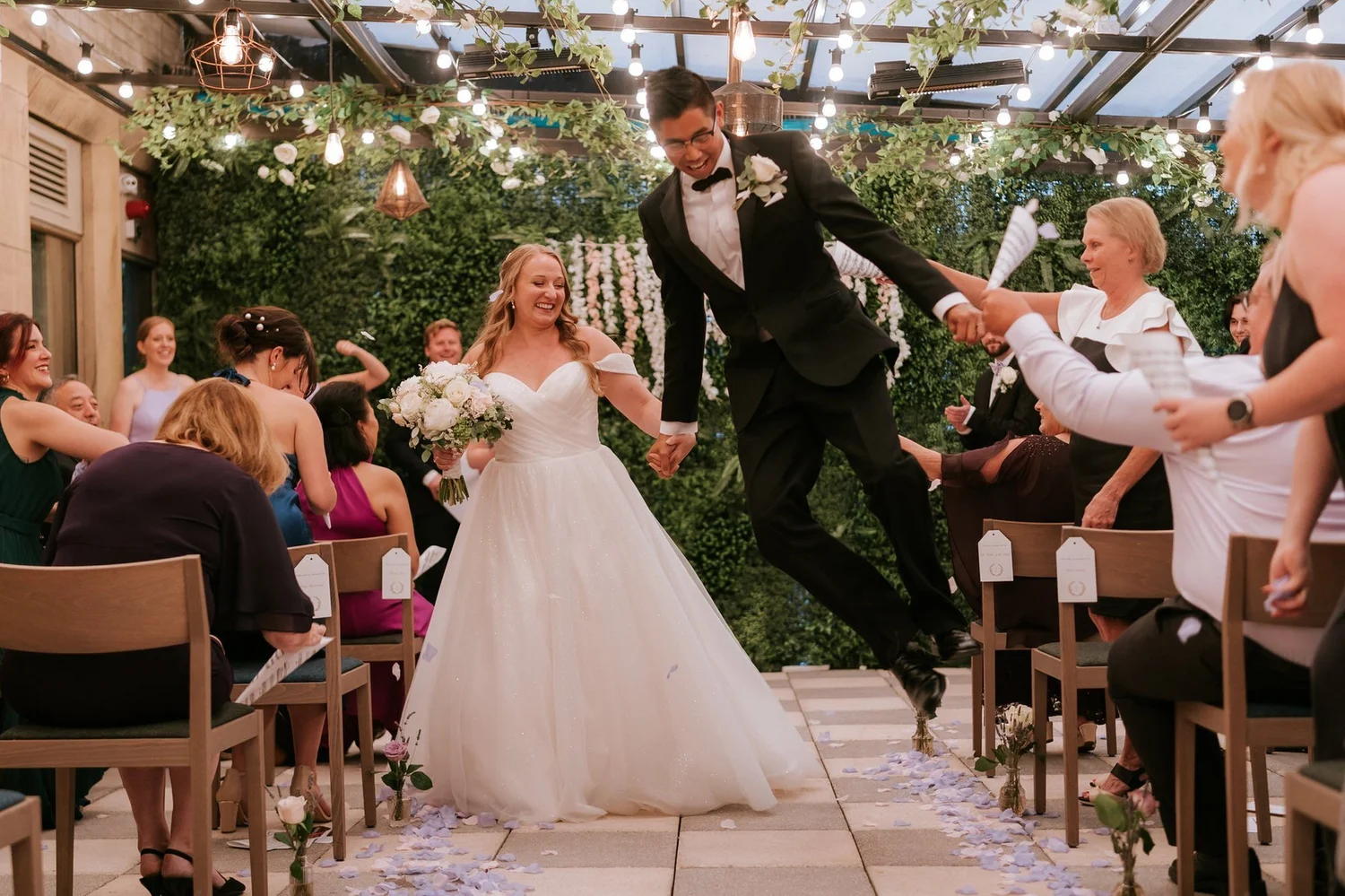 Carl jumping with joy as he and Allie walk back down the aisle together.