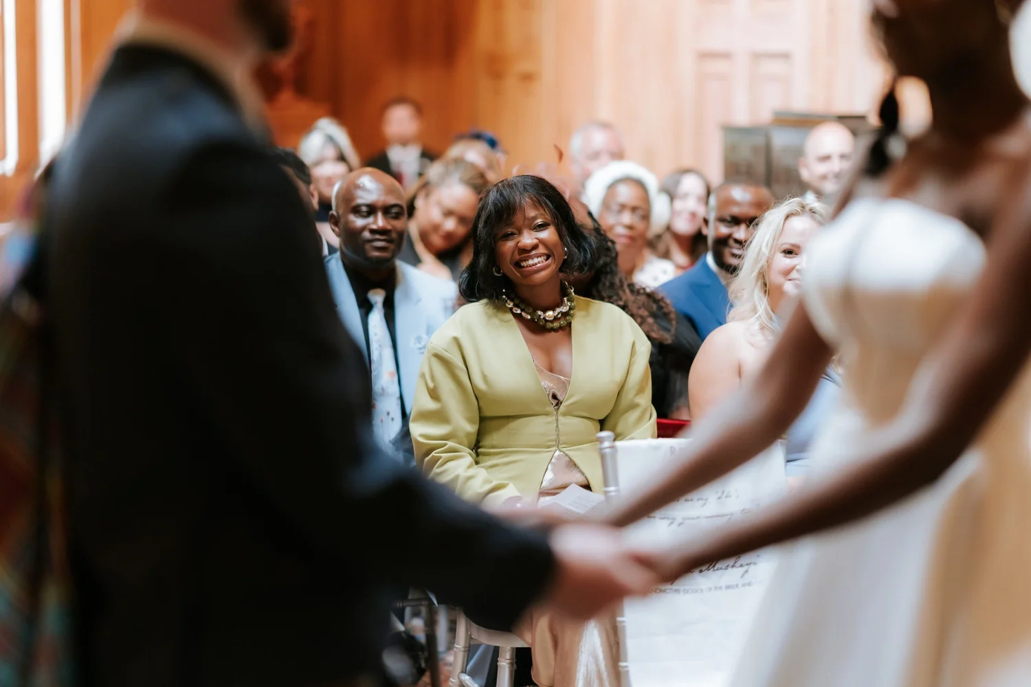 A guest watching Kuda and Jamie’s wedding ceremony.