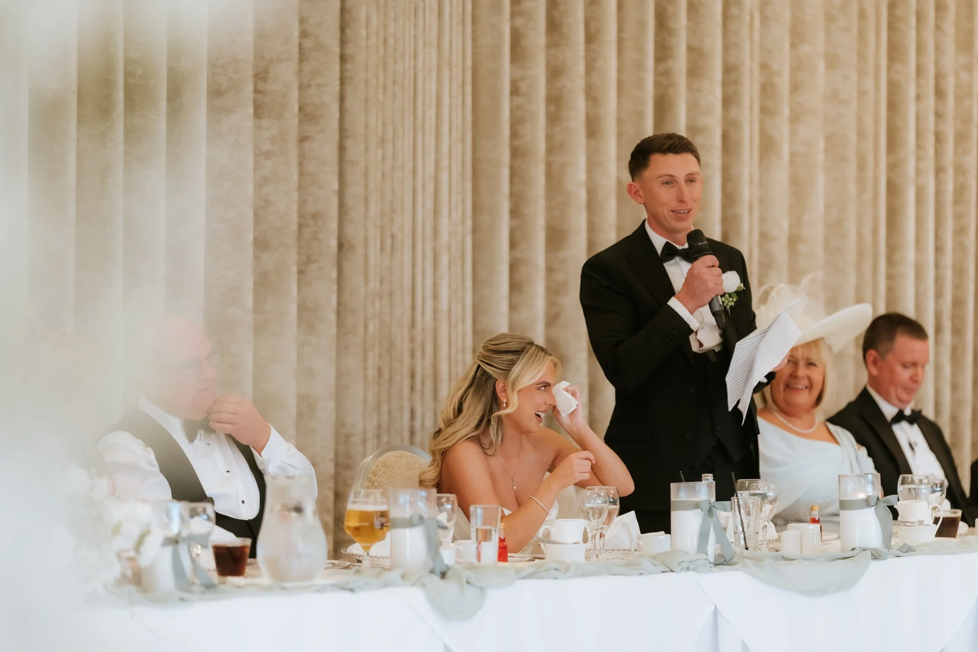 Aiden giving his speech at the wedding reception.