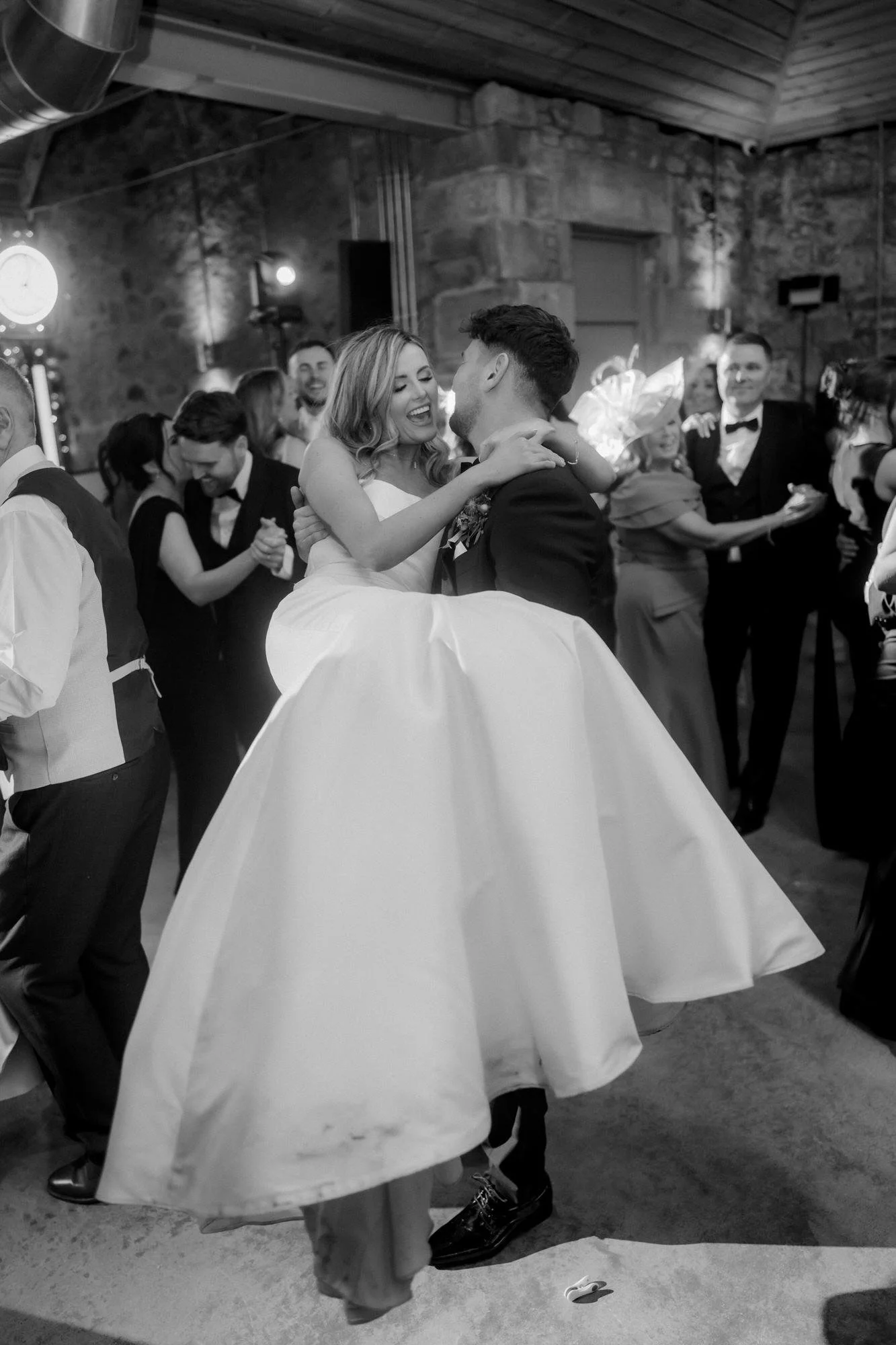 Natalie and Jamie embracing on the dance floor, in black and white