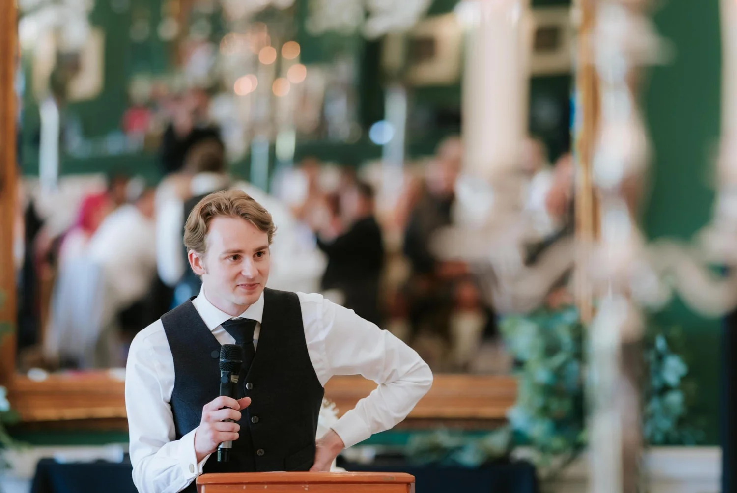 A speech at the lectern during Kuda and Jamie’s wedding breakfast.