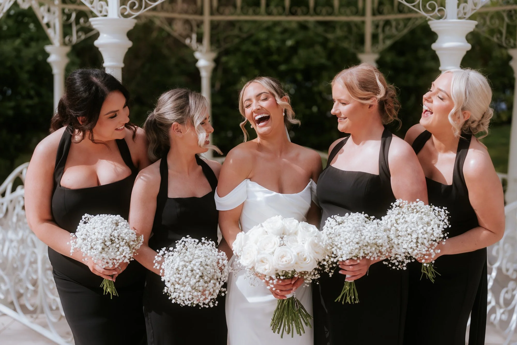 Bridesmaids laughing together outdoors