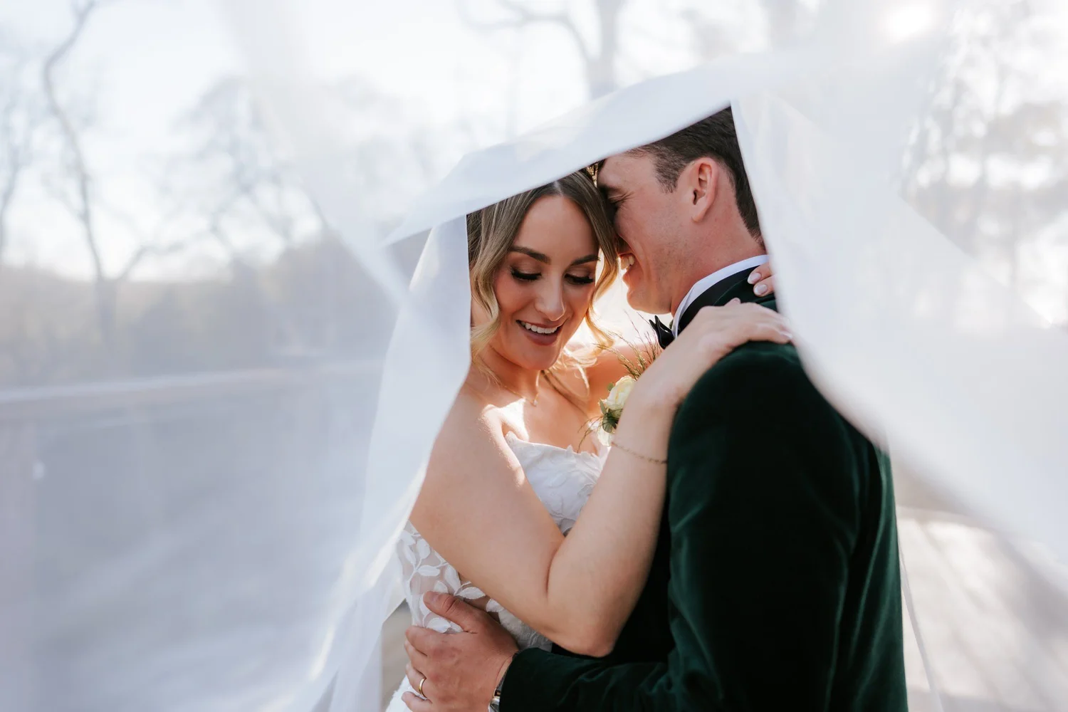 Ciara and Jonathon sharing a quiet moment beneath the veil.