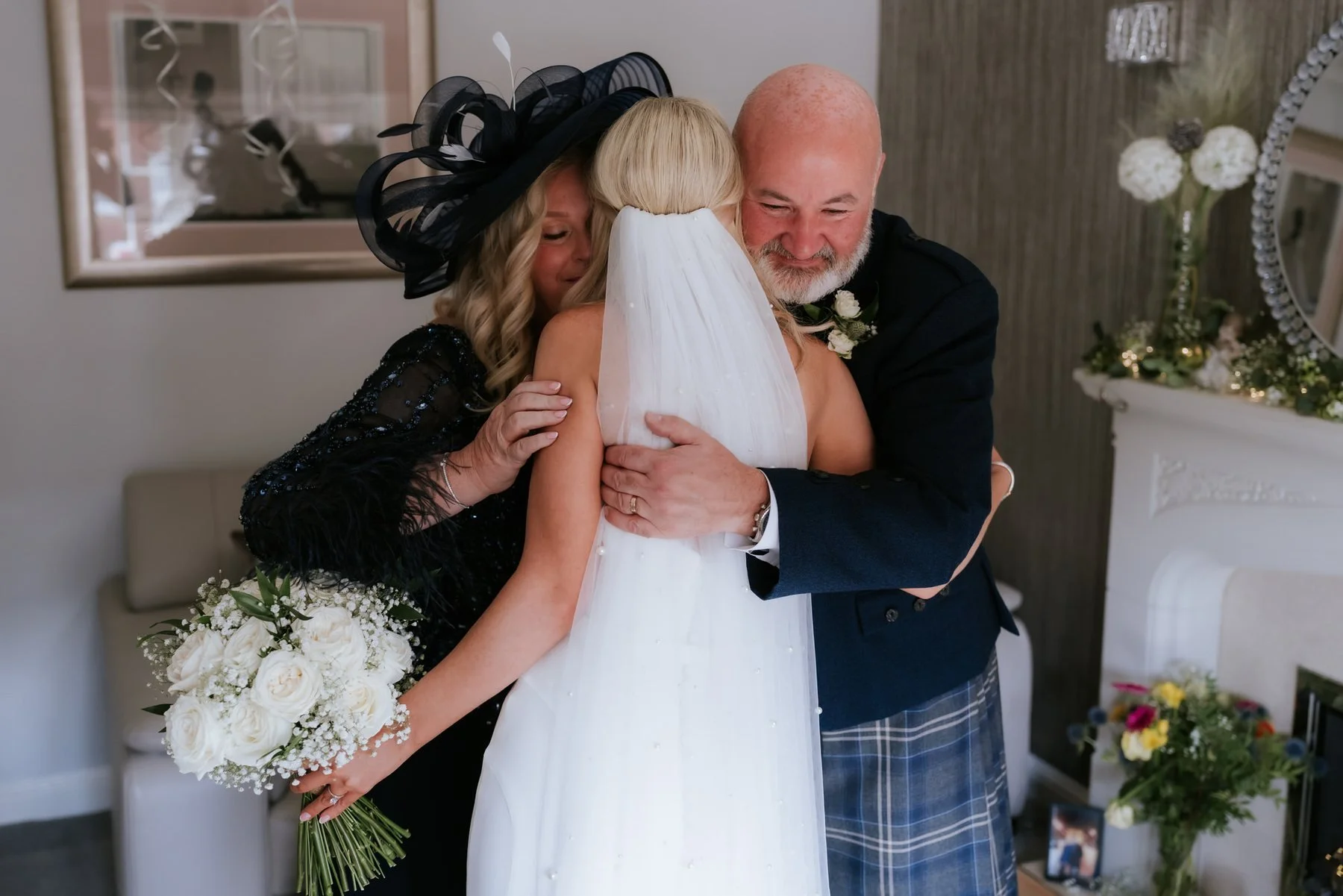 Lauren sharing a close family hug before leaving for her wedding.