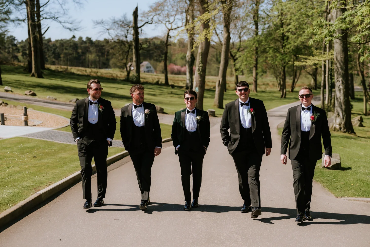 Jonathon and his groomsmen walking through the grounds at Enterkine House.