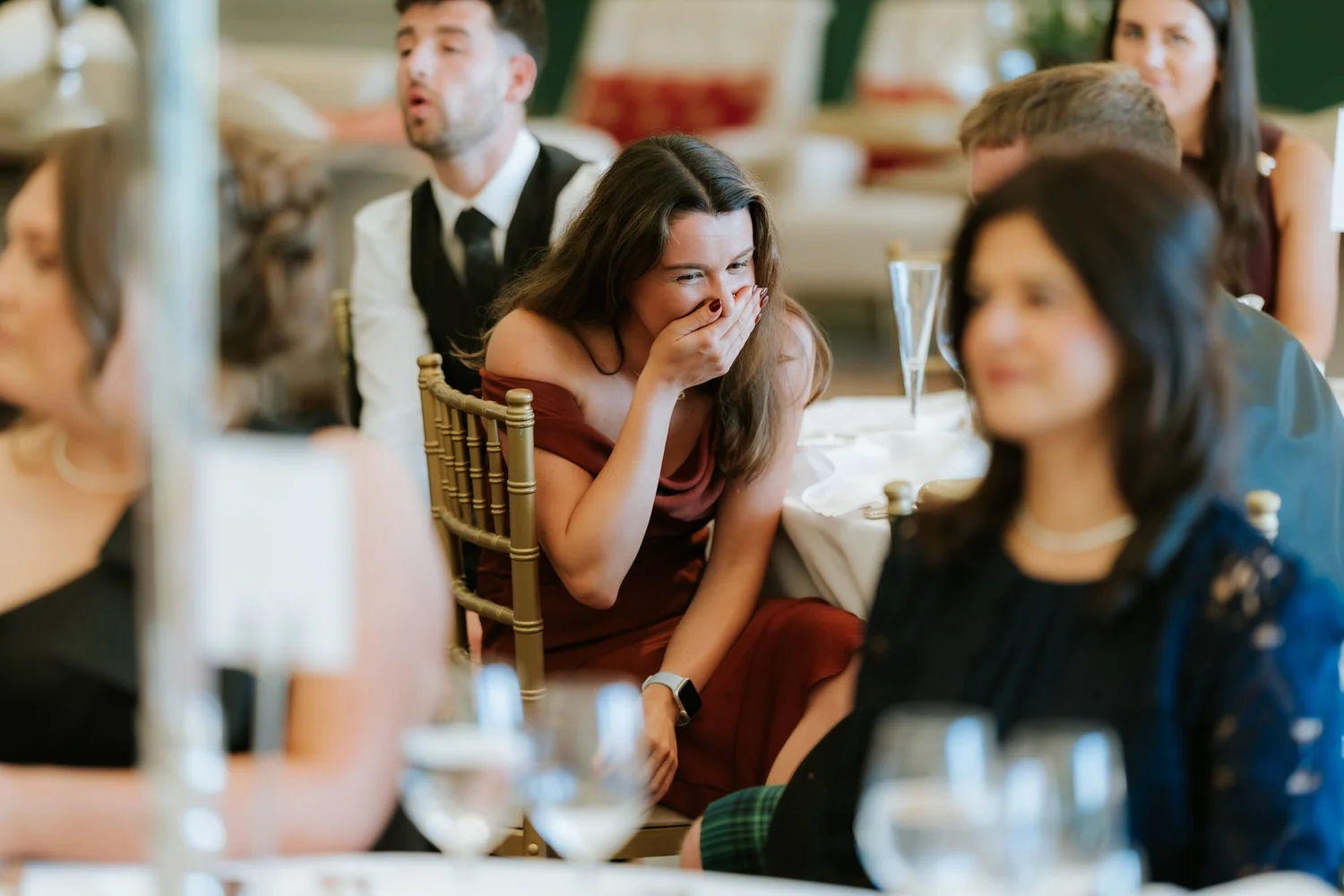 A guest reacting during the wedding speeches.