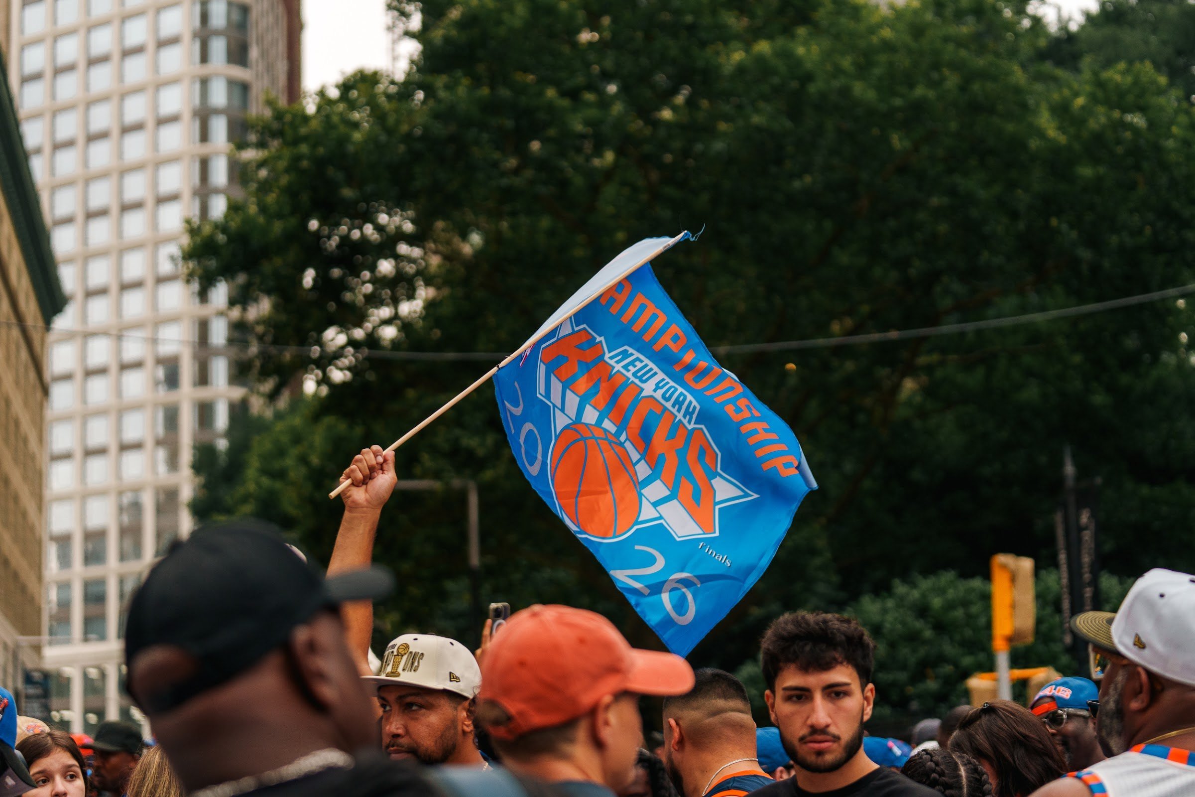 A Knicks flag raised over the crowd