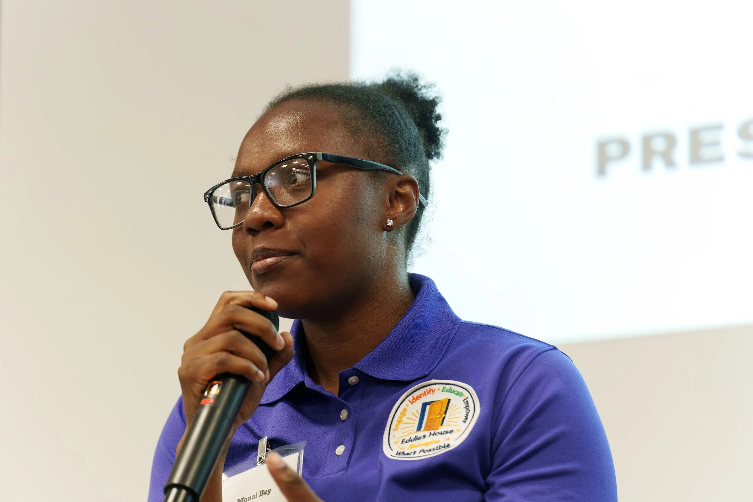 A young participant speaking to the room