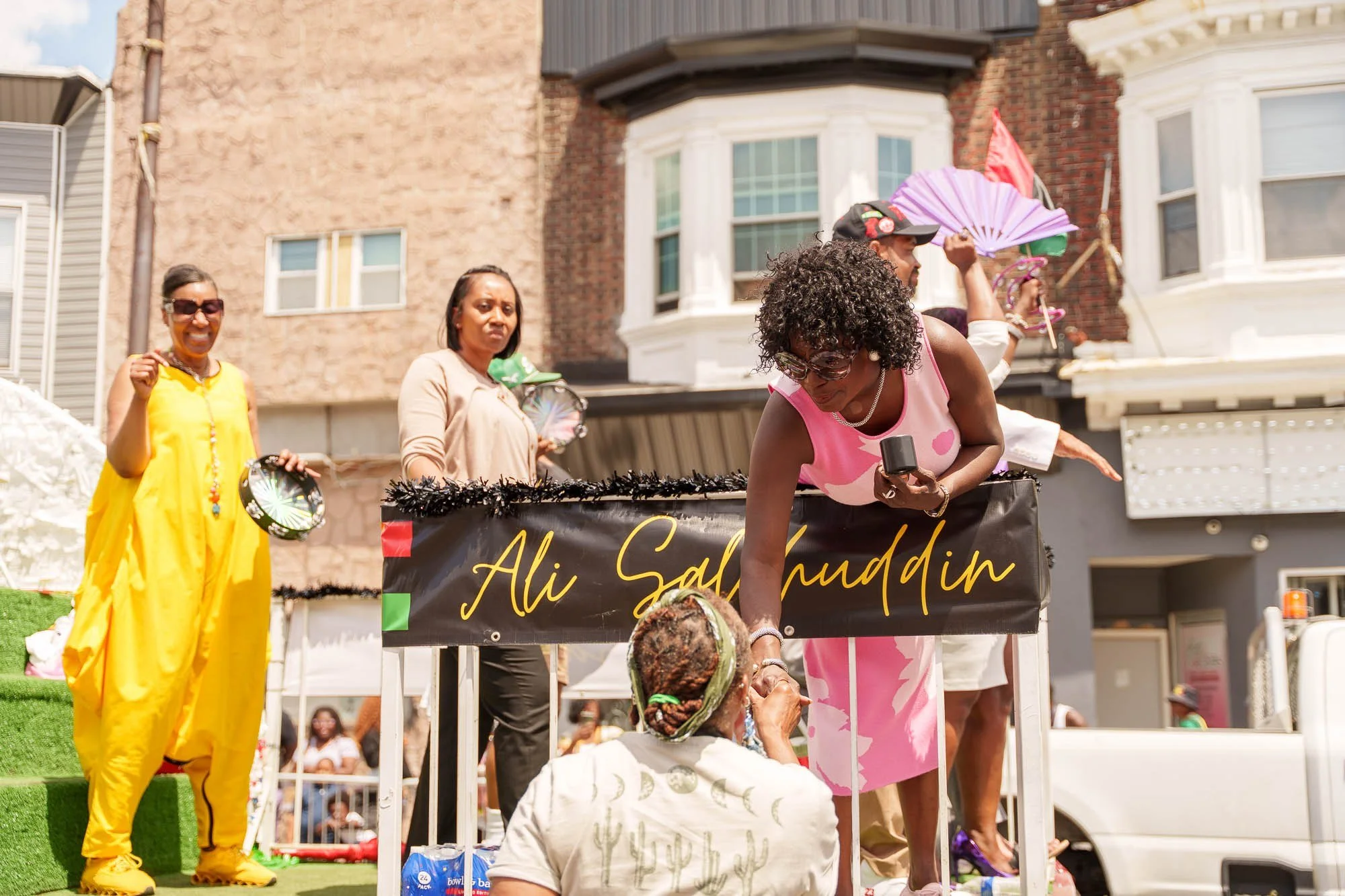 Performers in gold along the parade route