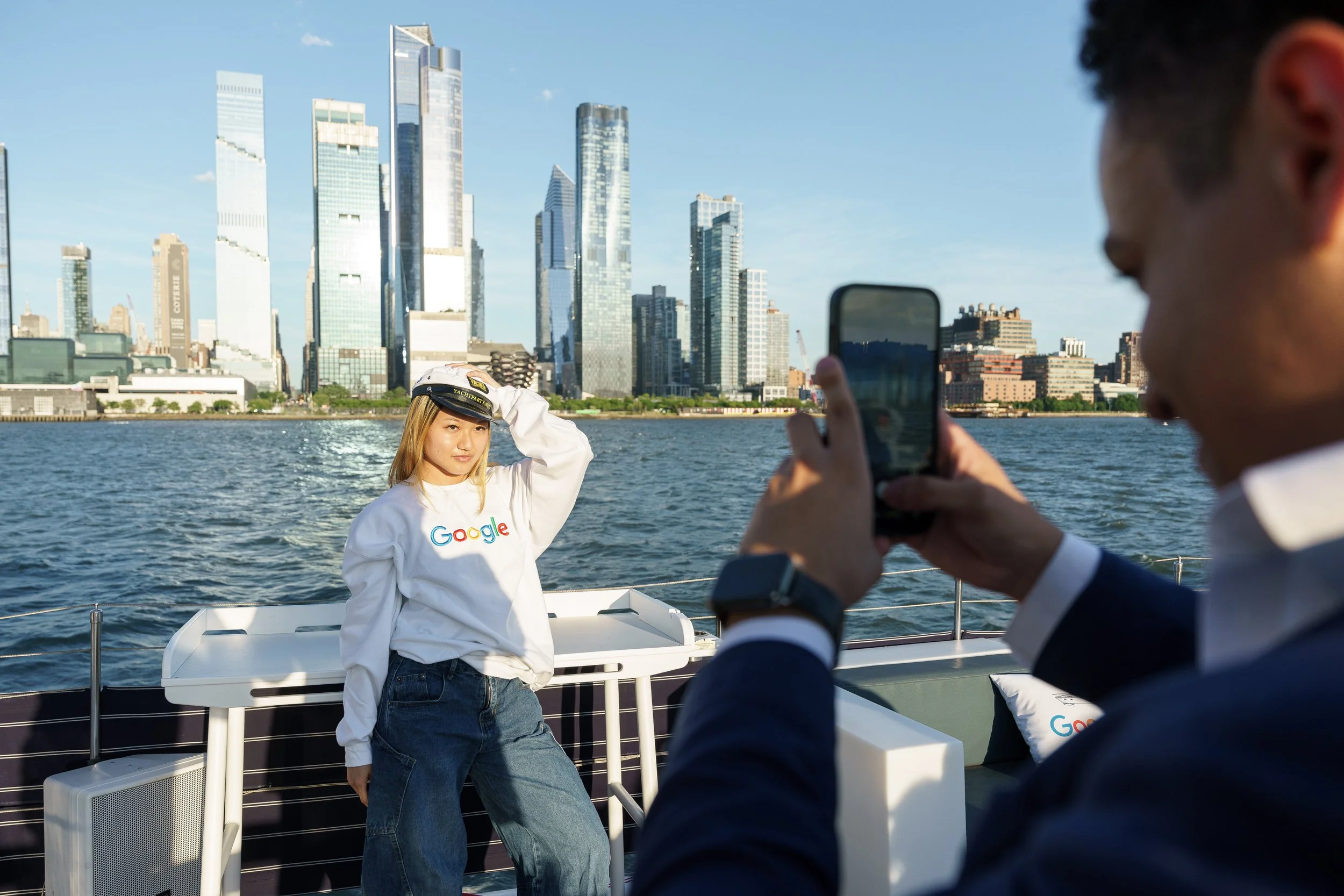 A creator photographing the skyline from the deck