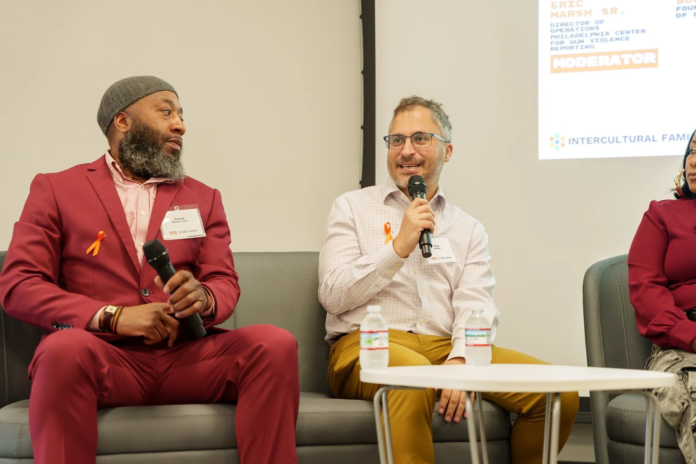 Two panellists in conversation on stage