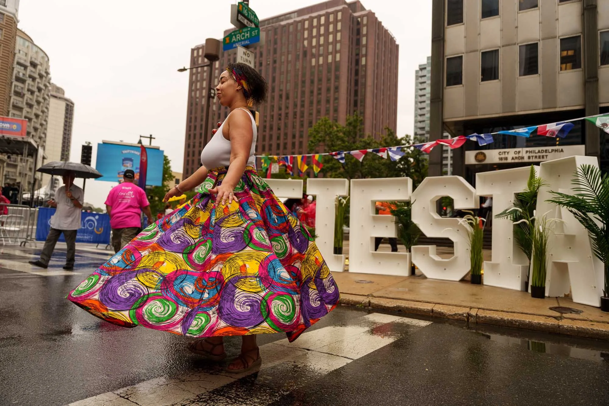 Dancer in a floral dress at the FIESTA letters