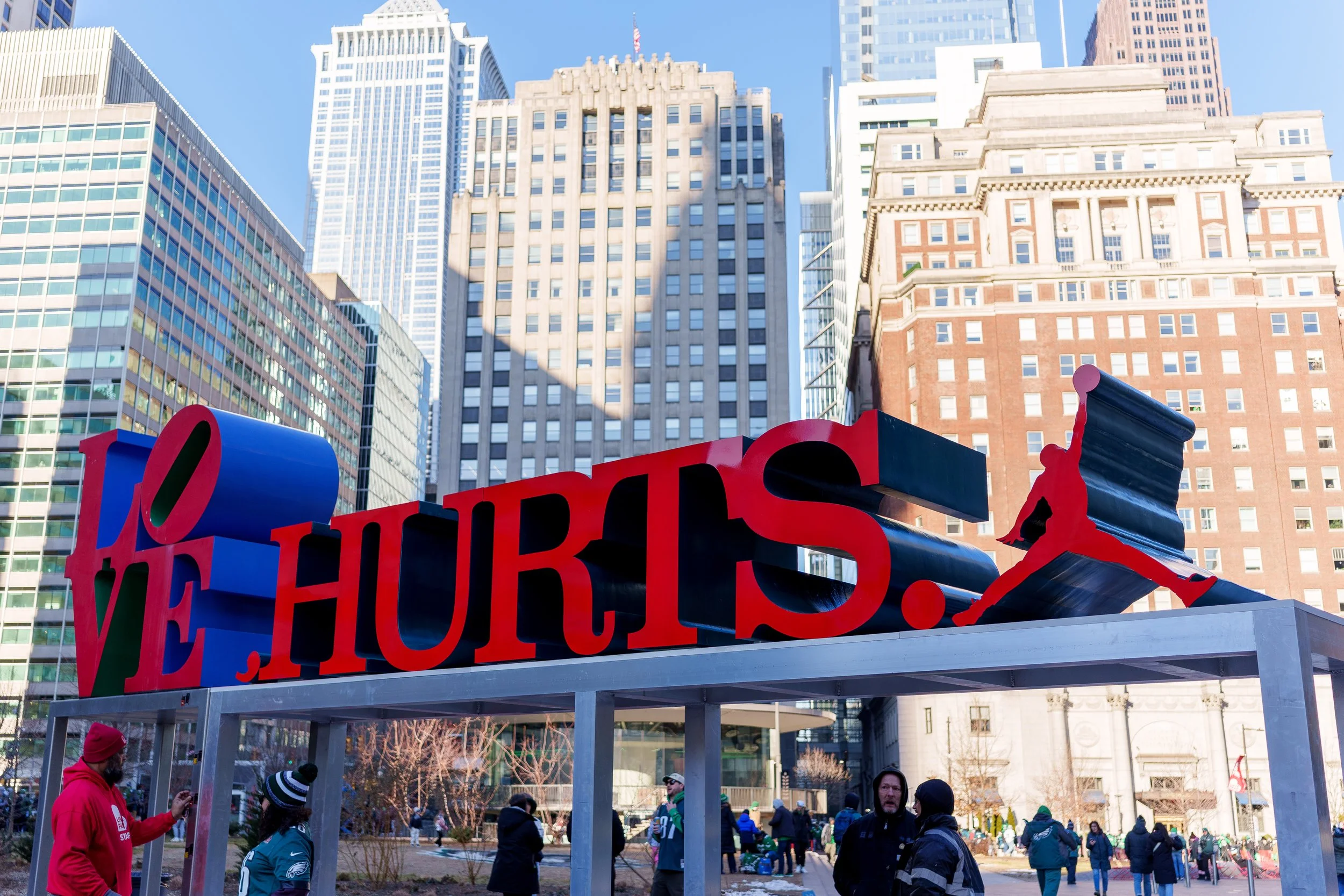 The LOVE HURTS. sculpture seen from the west side of Love Park