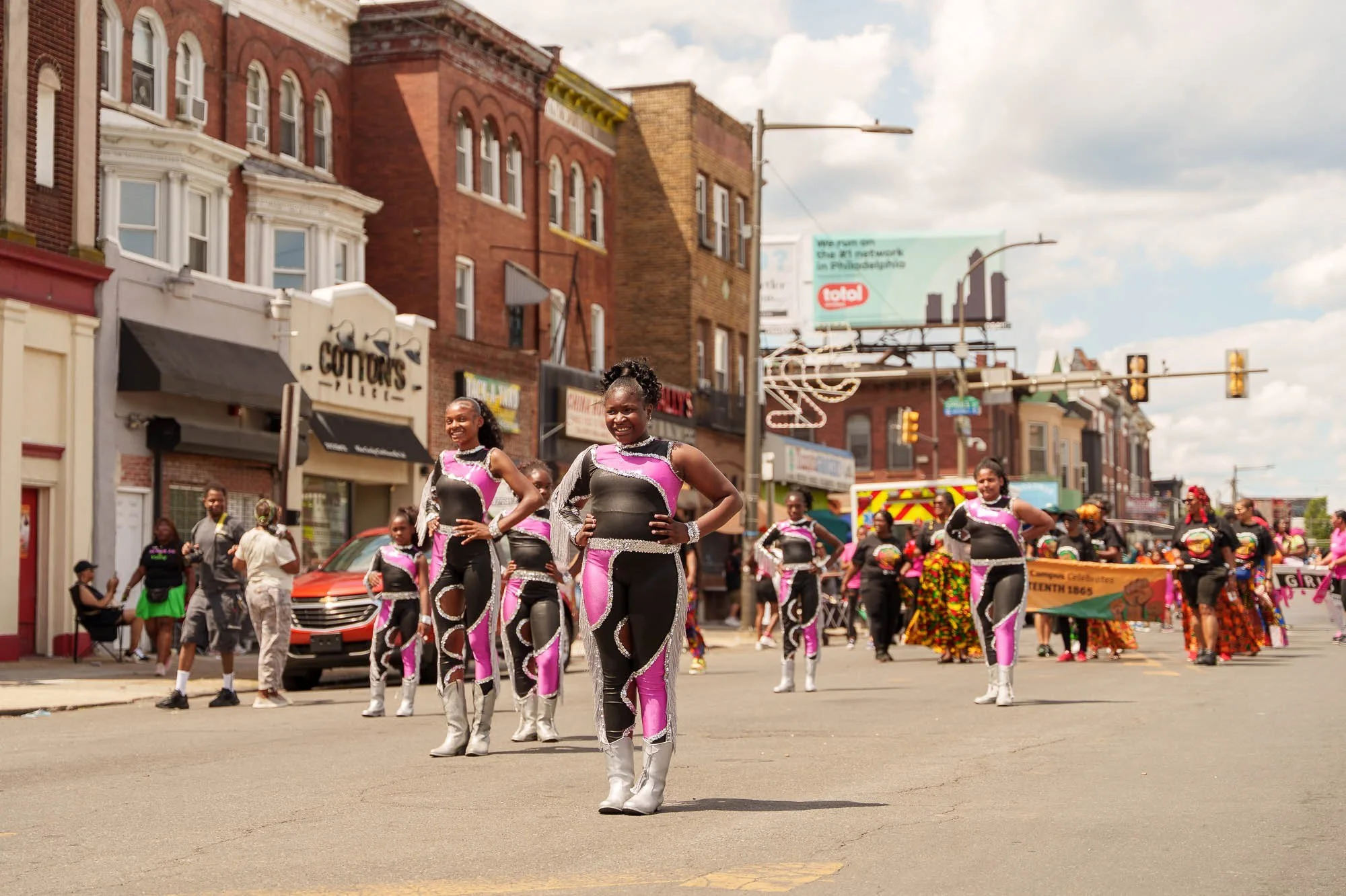 A drill team performing along the route