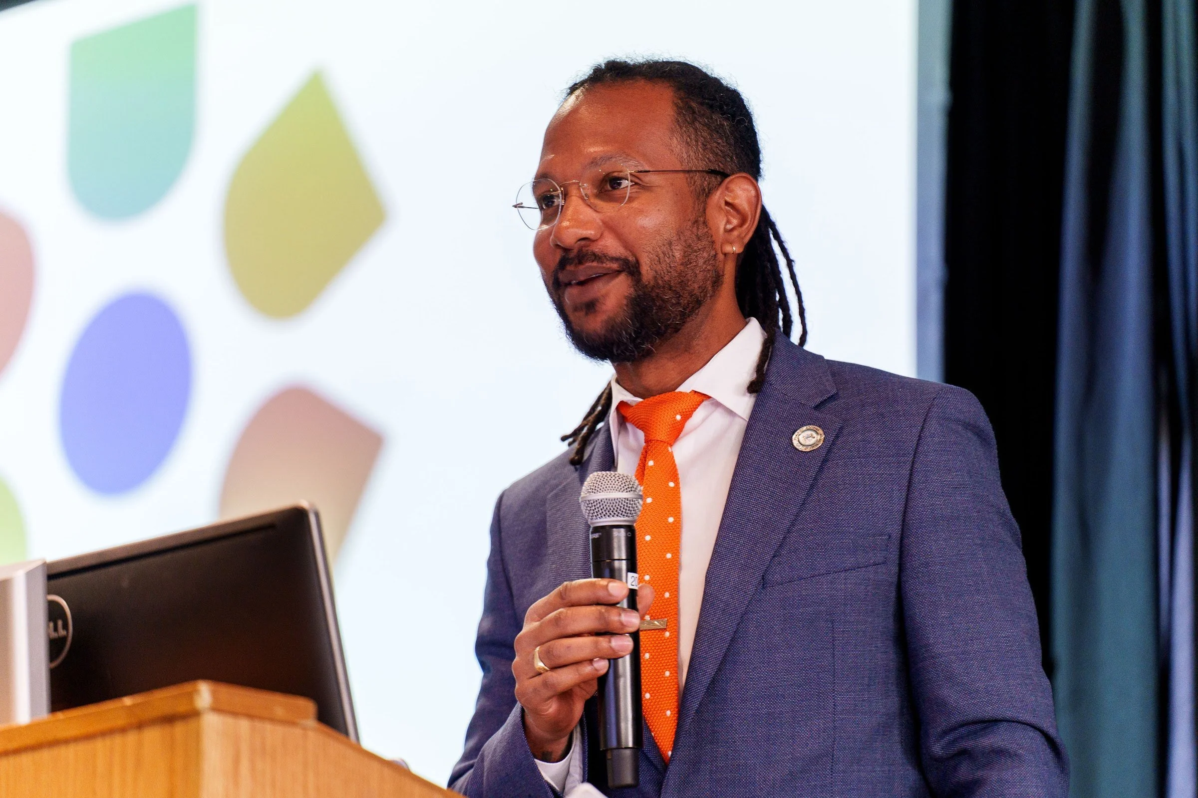 A speaker addressing the first Hope Symposium