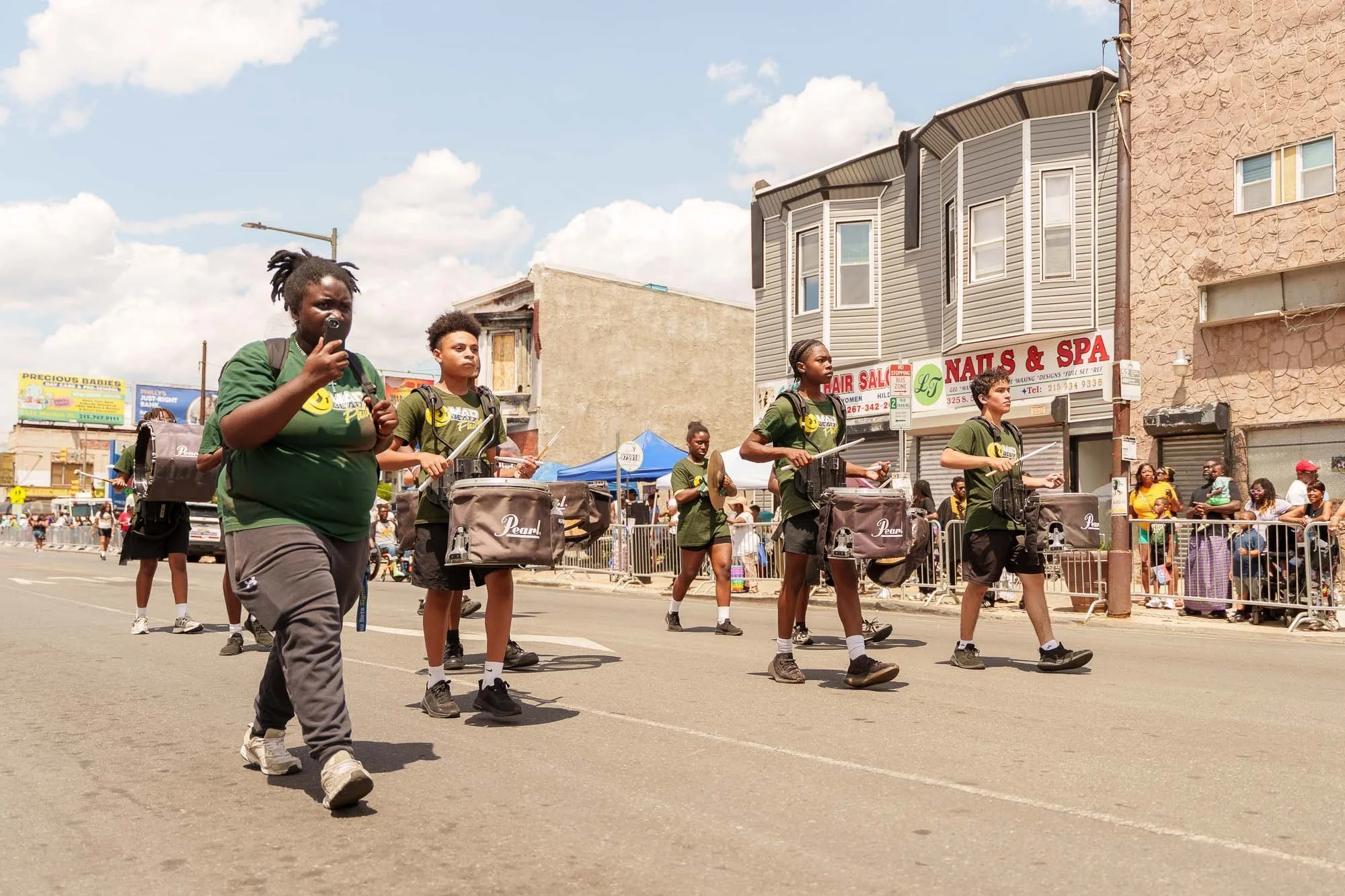 The drumline moving down the street