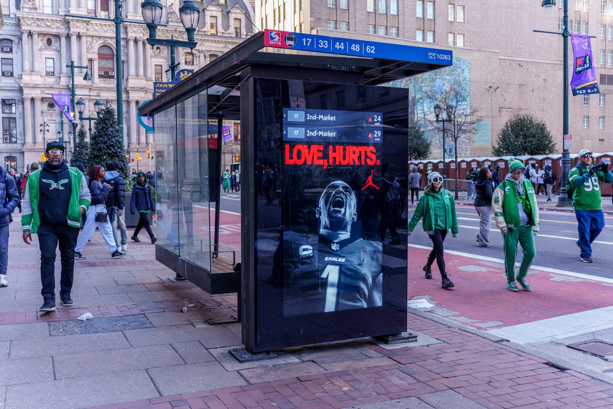 Bus shelter running the Love, Hurts. campaign ad on Broad Street