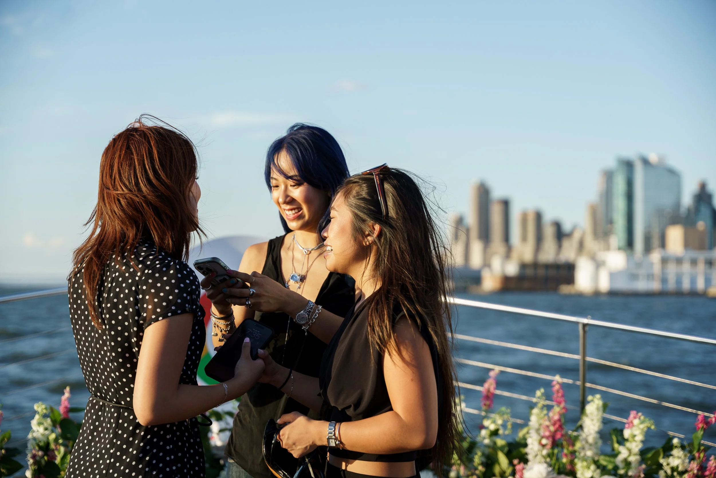 Creators at the Google wall with the skyline behind
