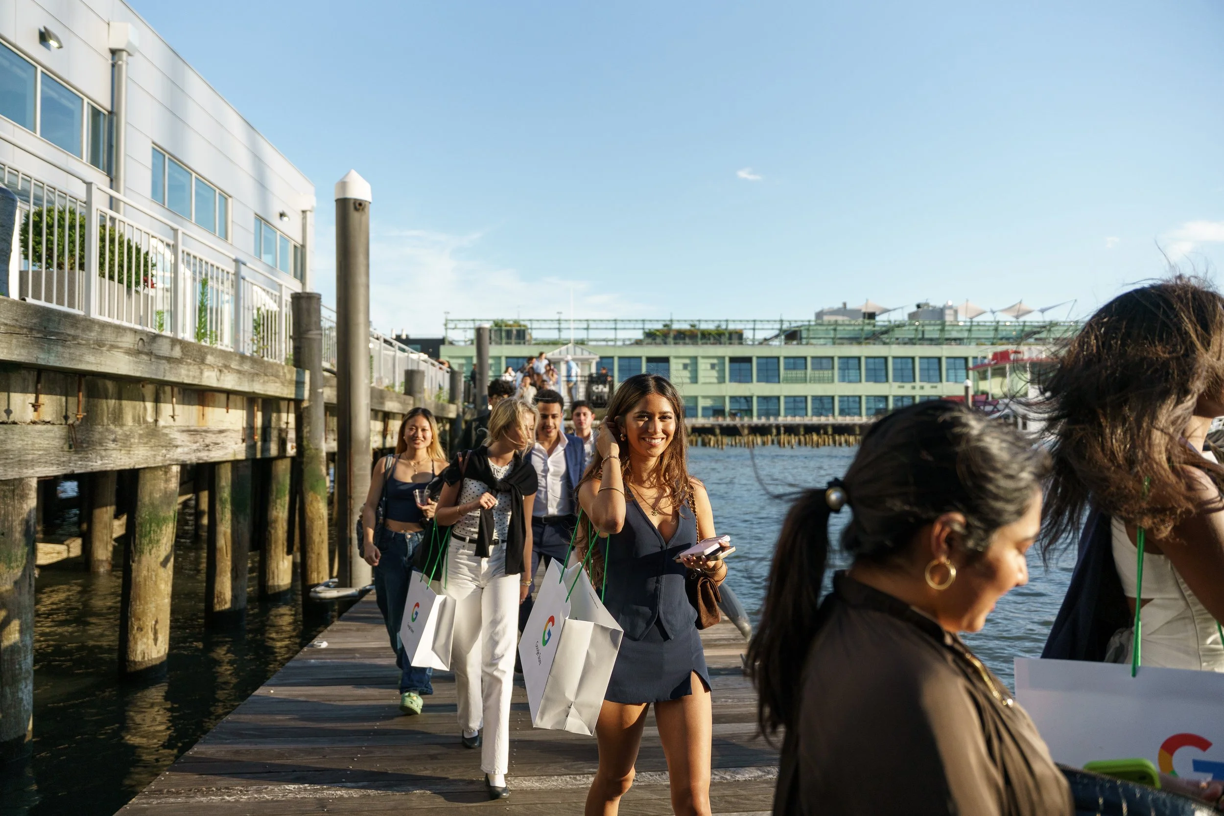 The group walking the pier to the boat