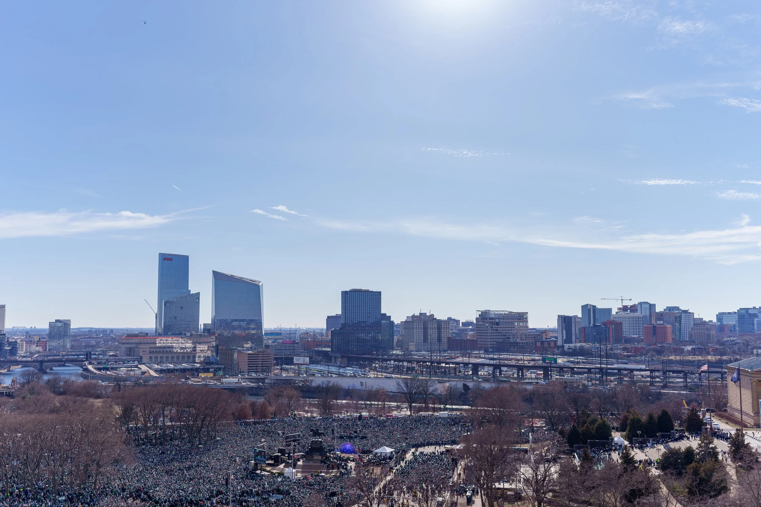Elevated view over the crowd toward the Philadelphia skyline