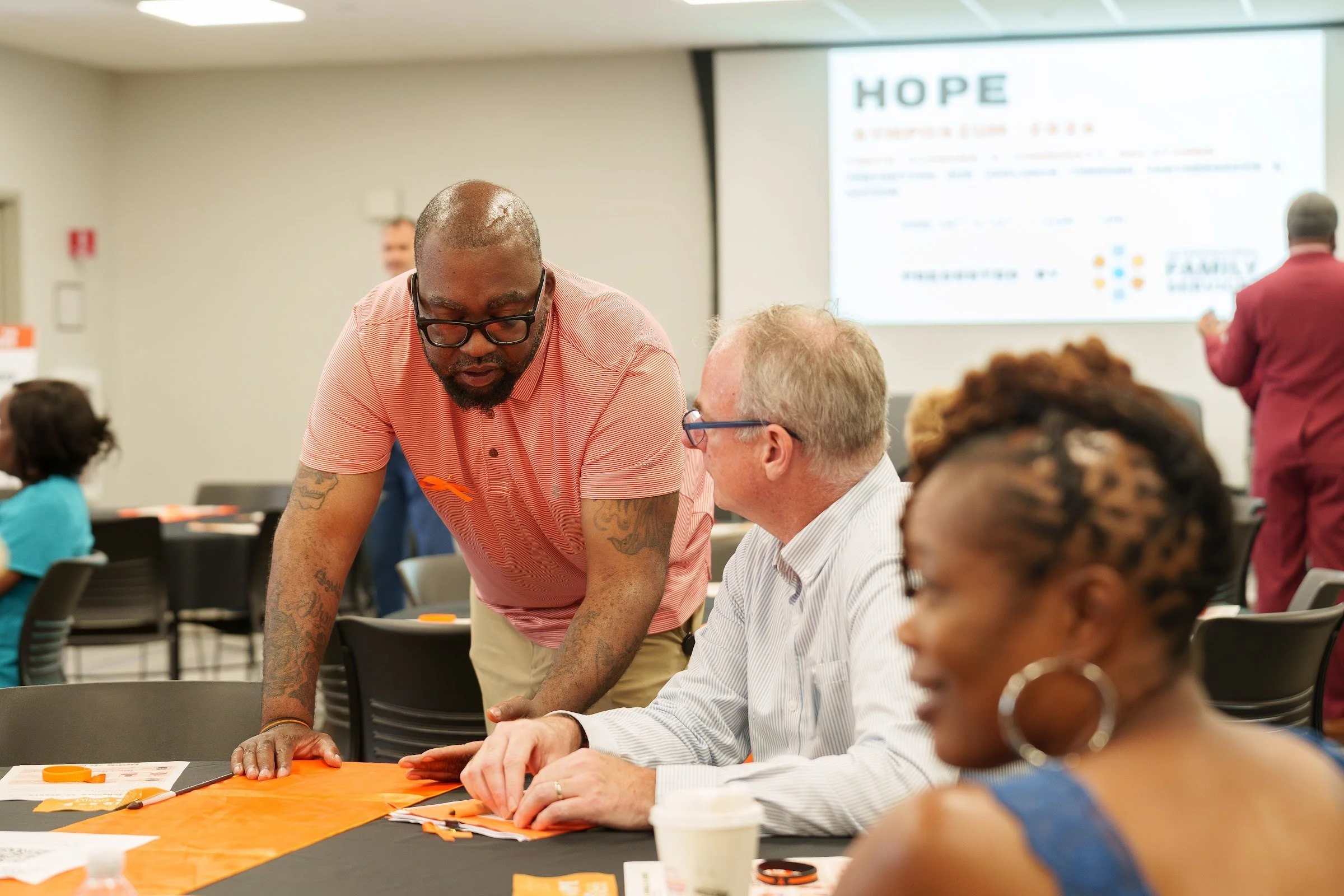 A facilitator leading a breakout table