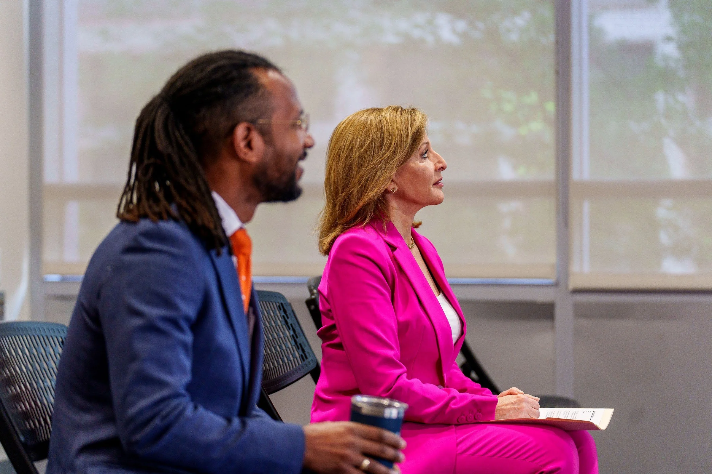 A seated conversation between two speakers