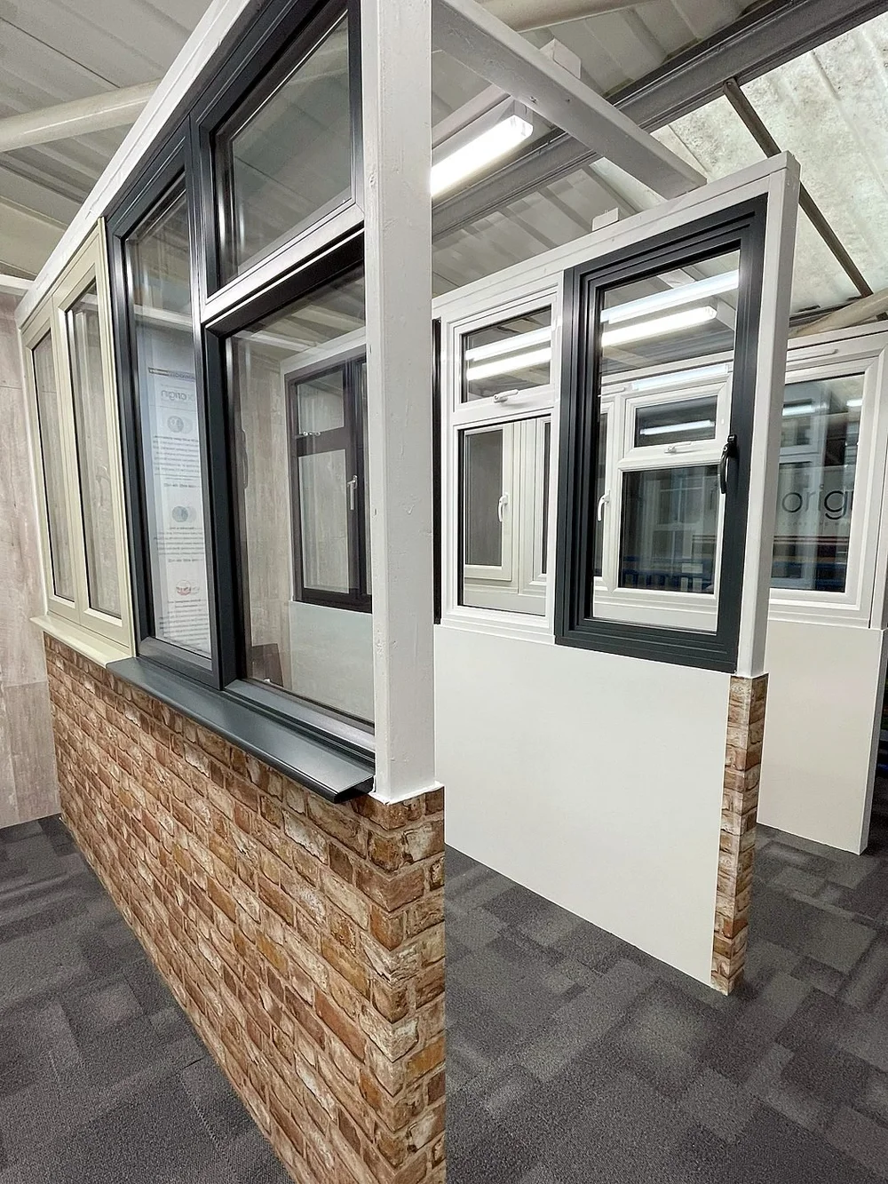 Window displays set into brick piers in the showroom
