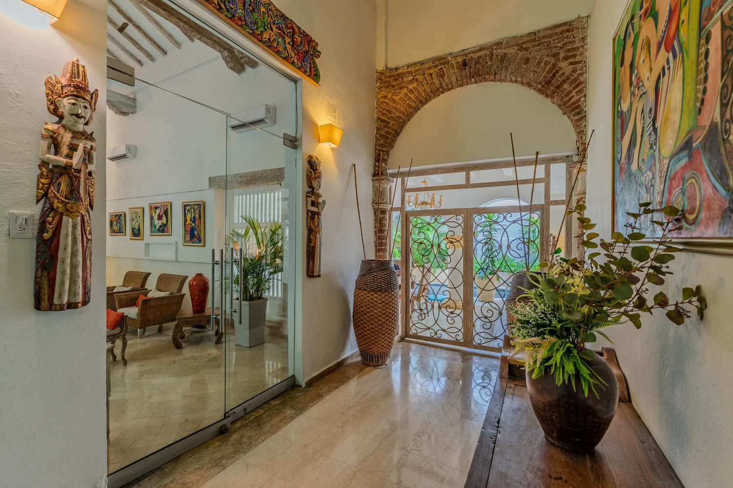 Entrance hall and living area of Casa Gil Art Boutique, a colonial villa in Cartagena.
