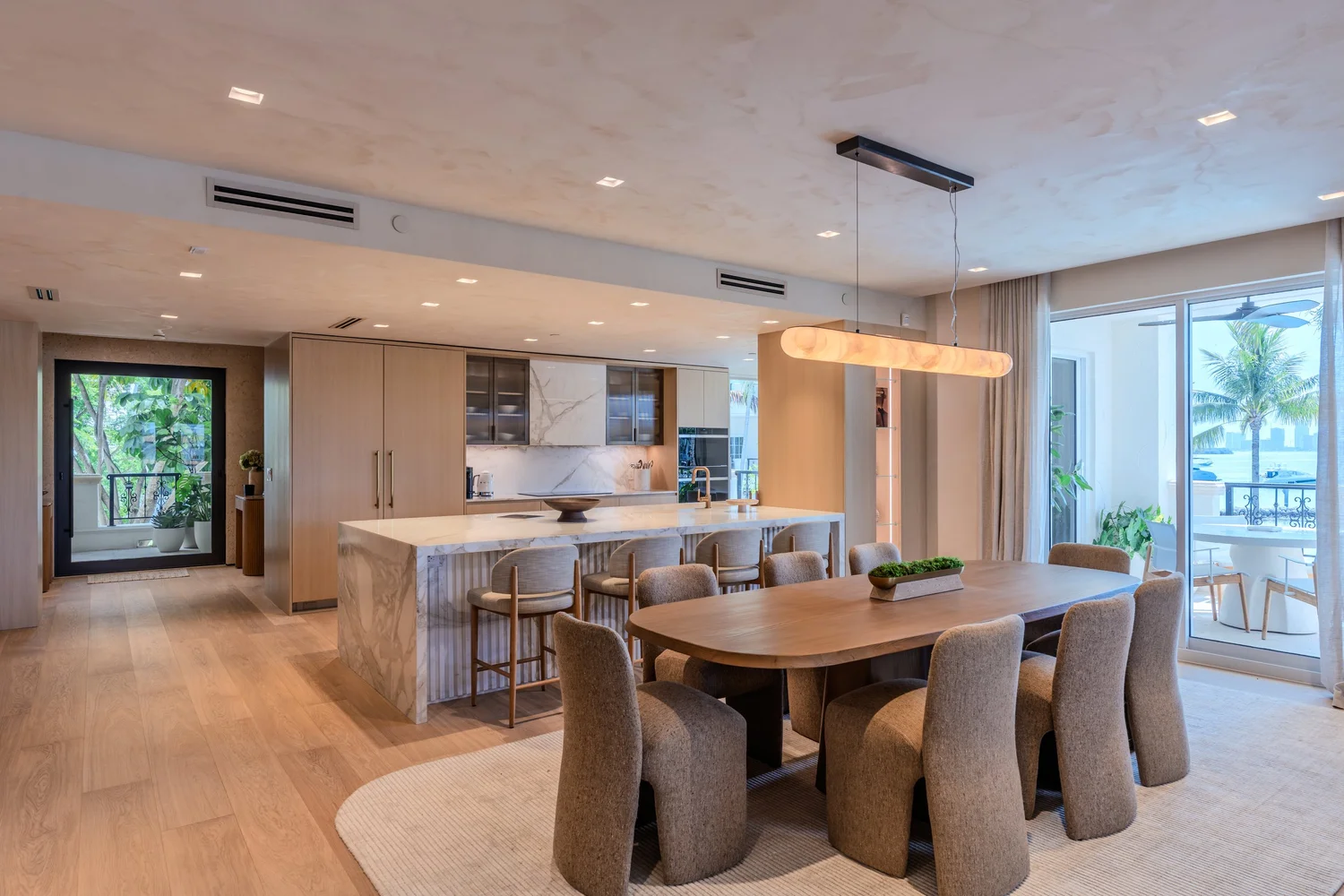 Modern kitchen and dining area photographed for luxury real estate photography in Miami